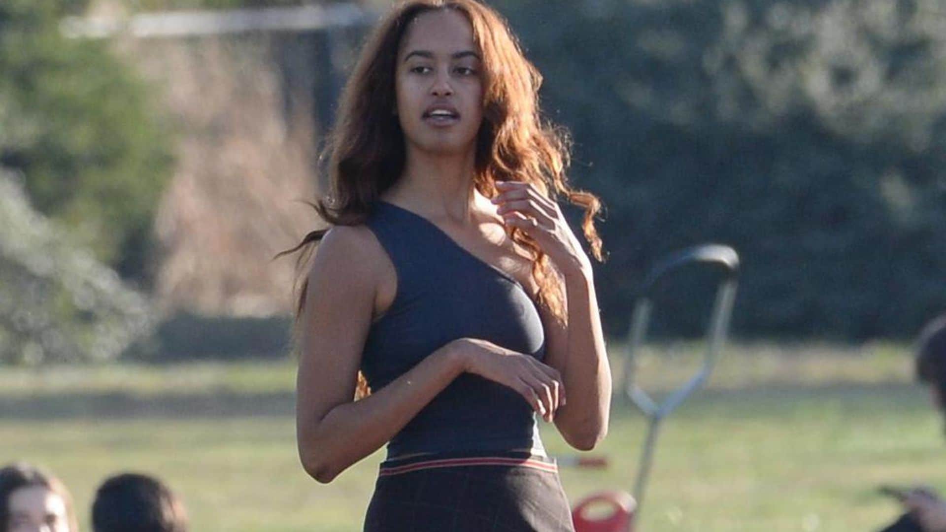 Malia Obama’s chic fall outfit includes high slit skirt and leather boots