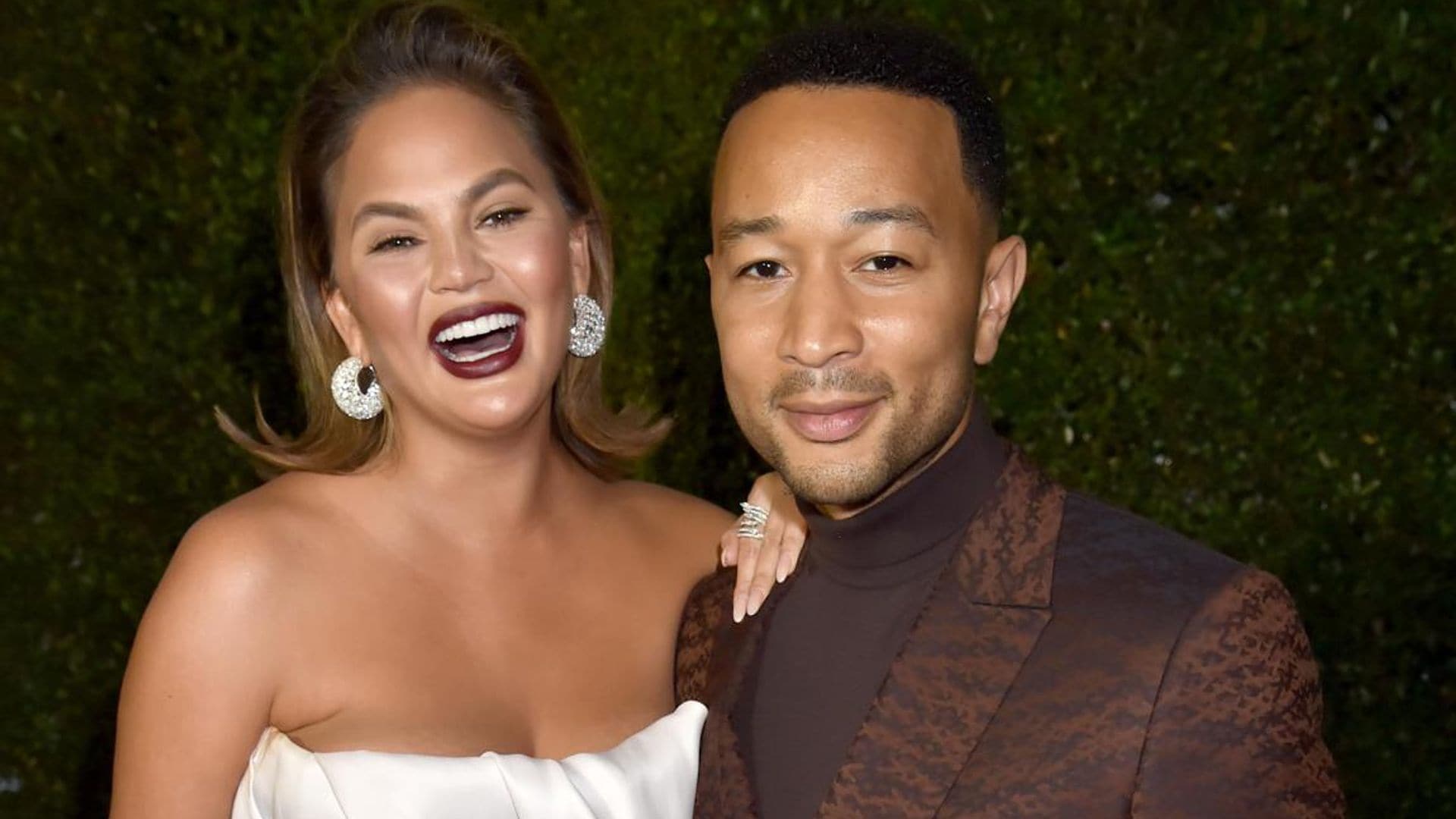 Chrissy Teigen and John Legend trade food with a fan and it's hysterical