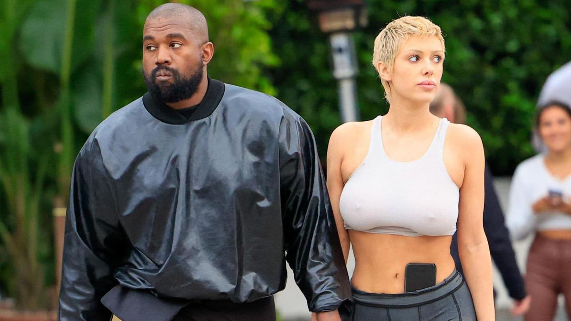Bianca Censori poses for Kanye West in black micro bikini and leather corset