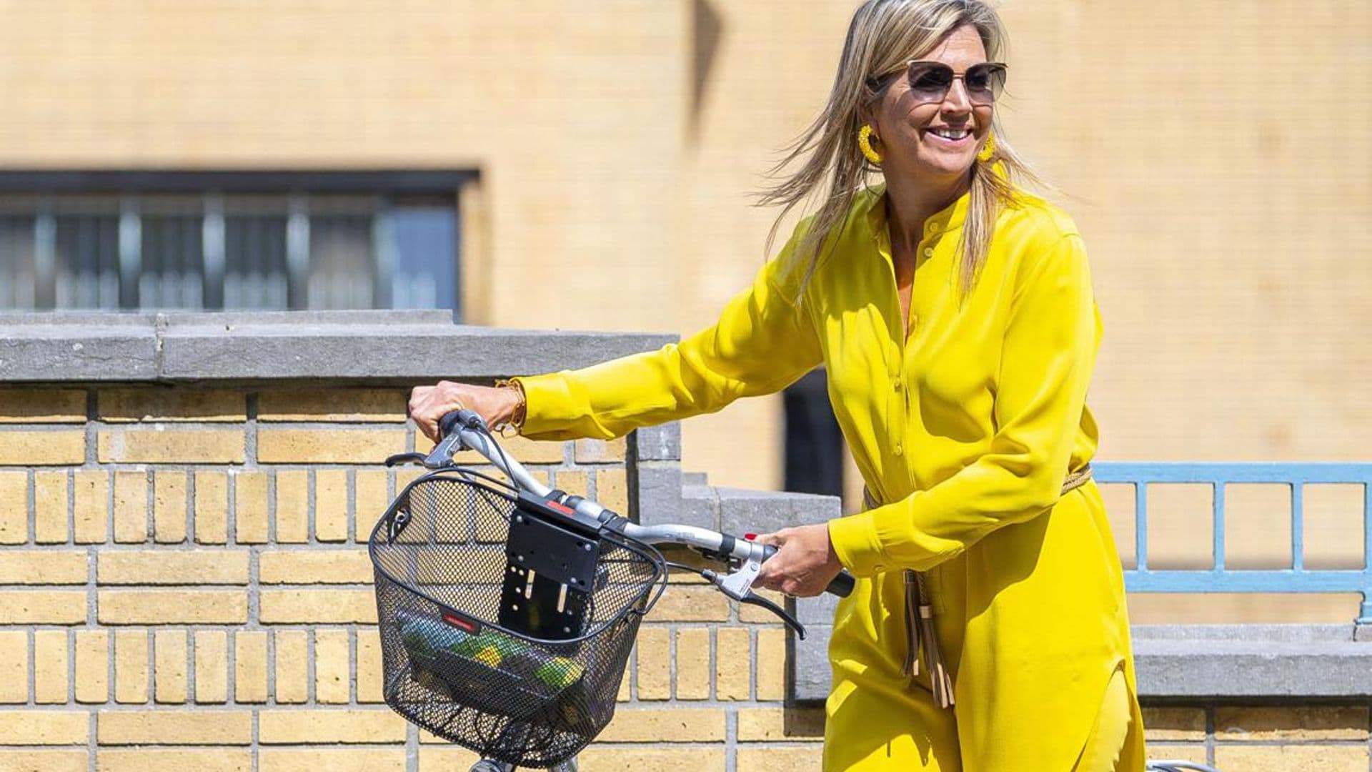 Queen Maxima is a ray of sunshine in latest look for a bike ride and museum visit