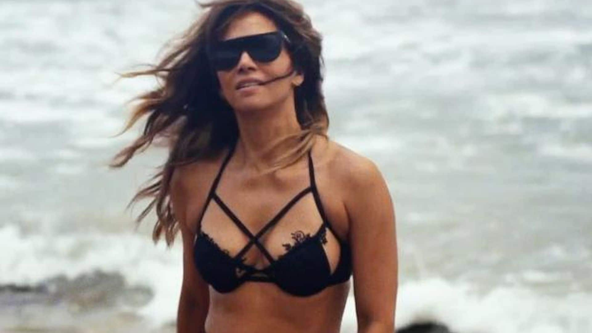 Halle Berry recreates iconic 007 bikini beach walk at 54