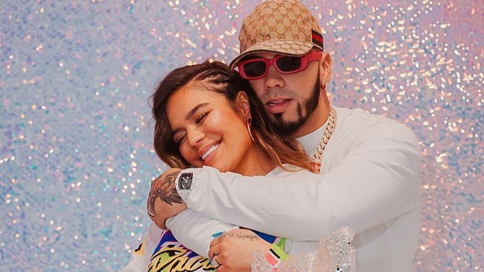 Karol G and Anuel AA posing together at her birthday party