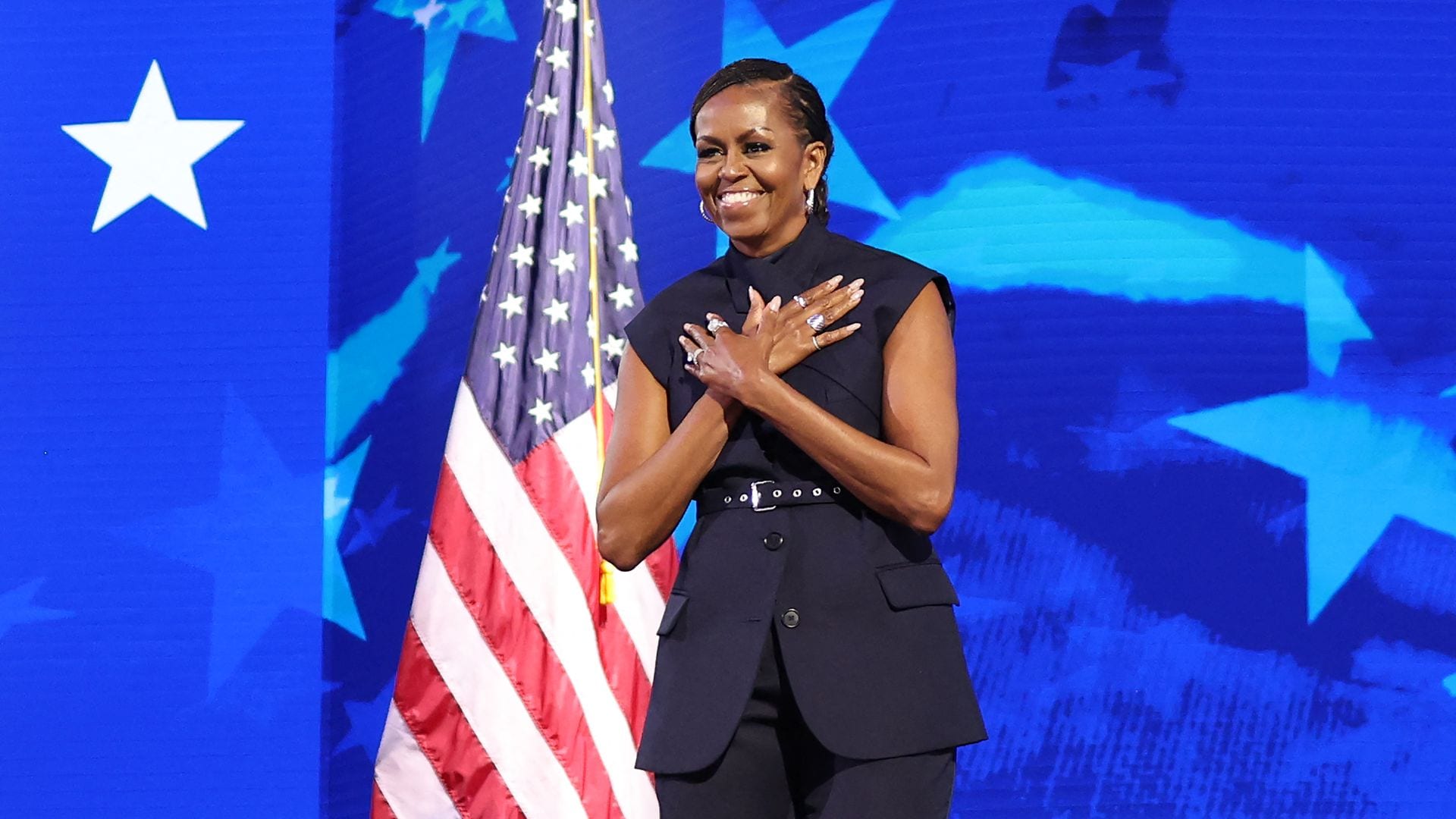 Michelle Obama's sophisticated navy blue suit at the DNC is a creation of Dominican designer Fernando García