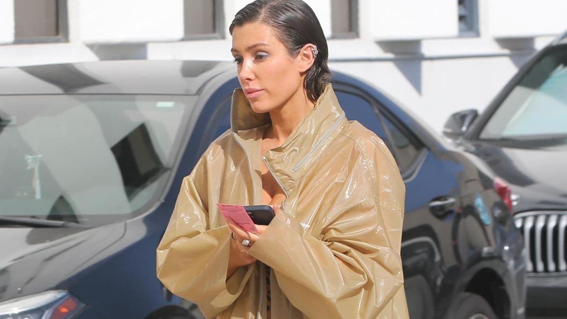 Bianca Censori covers in semi-sheer trench coat amid pregnancy rumors