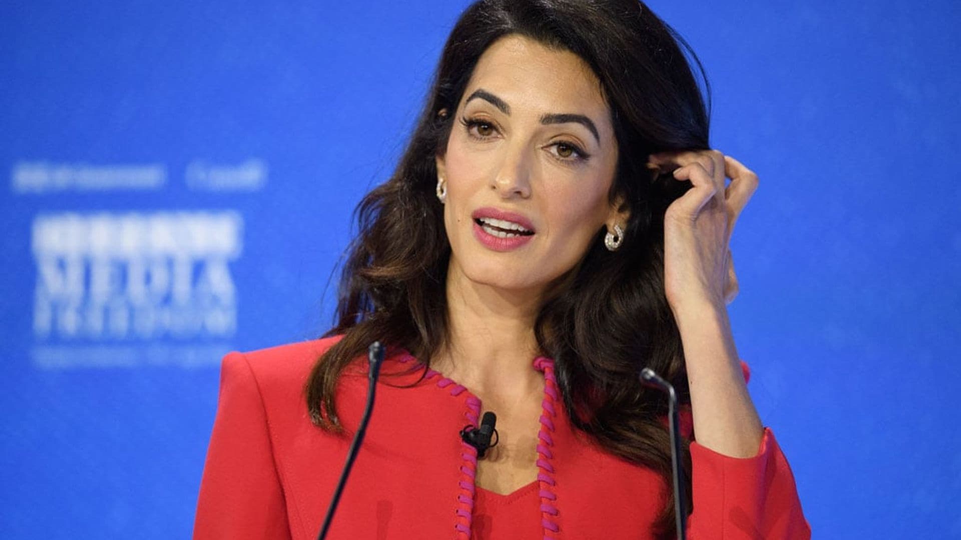 Amal Clooney shows us how to rock two bold statement suits during press conference