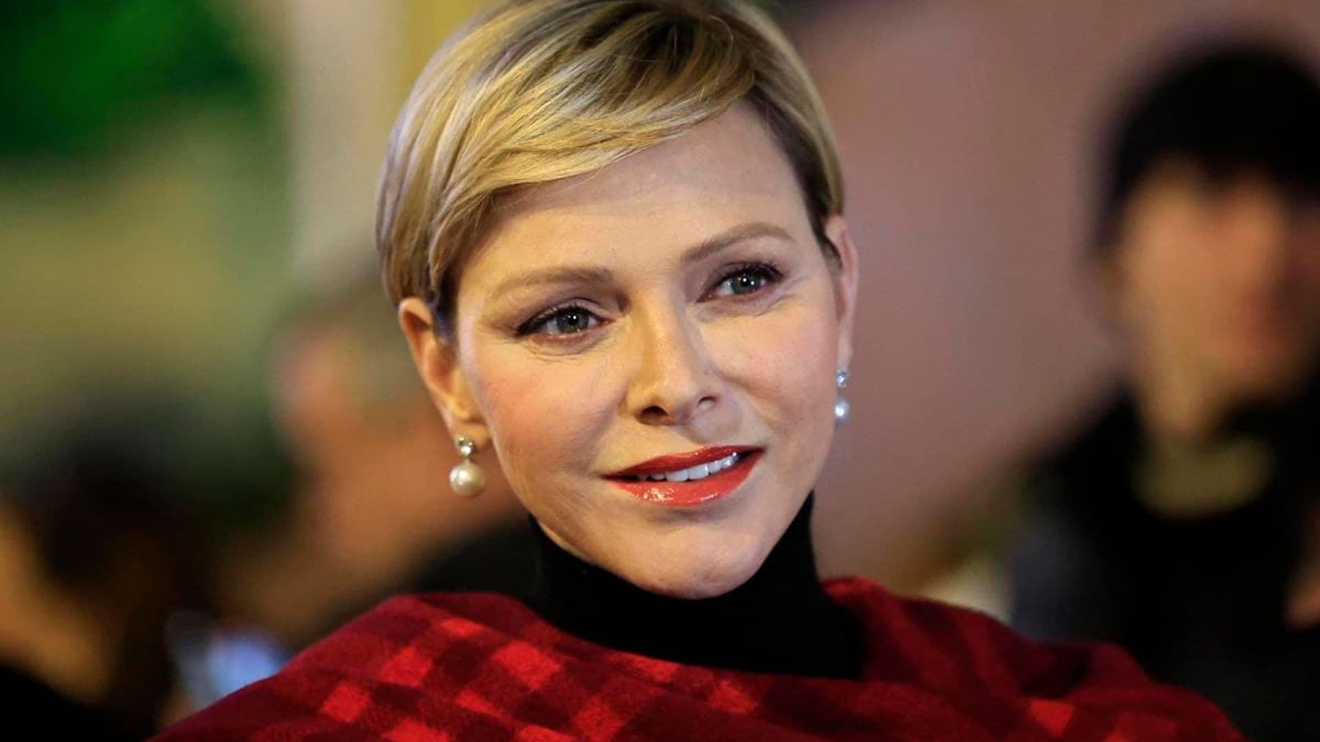 Princess Charlene looks merry in red at inauguration of Christmas village