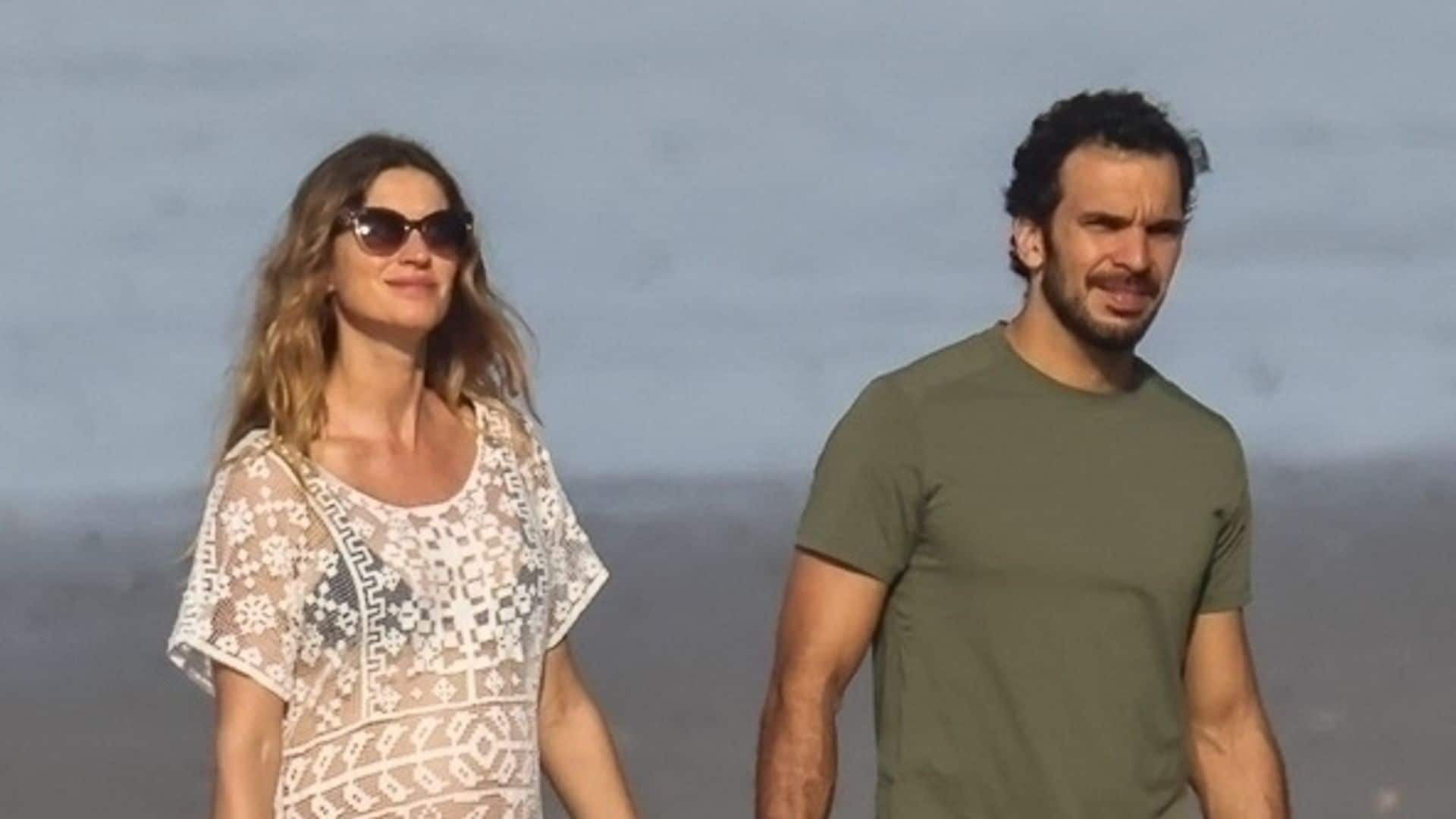 Gisele Bündchen shows off her growing baby bump while vacationing with boyfriend Joaquim Valente