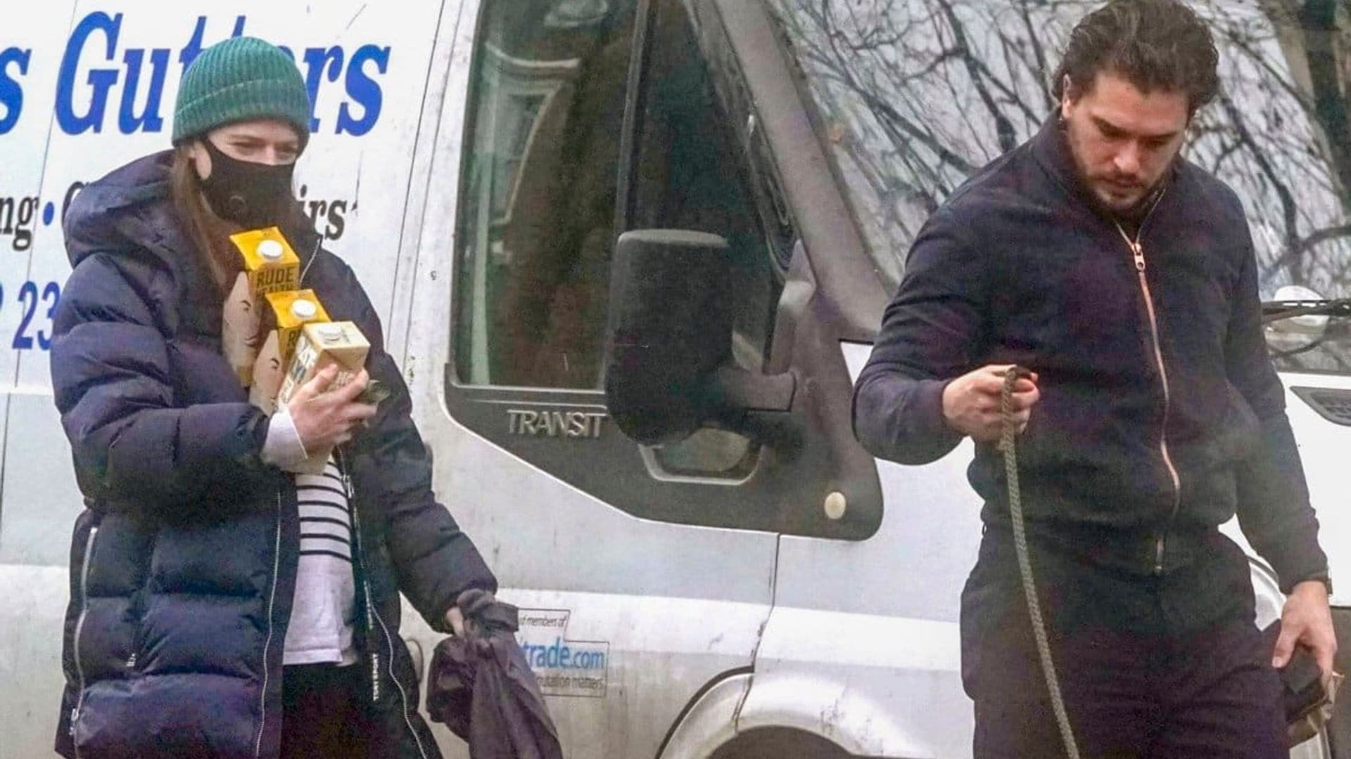Rose Leslie hides baby bump and balances milk while walking the dog with Kit Harrington