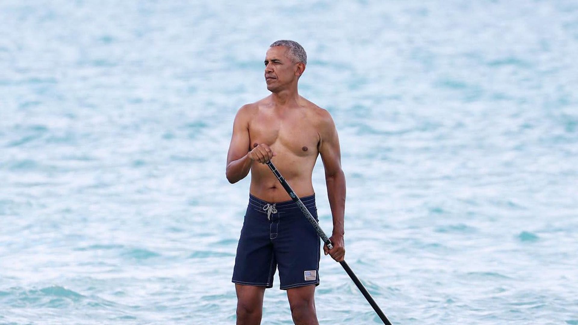 Barack Obama soaks up the sun shirtless in Hawaii