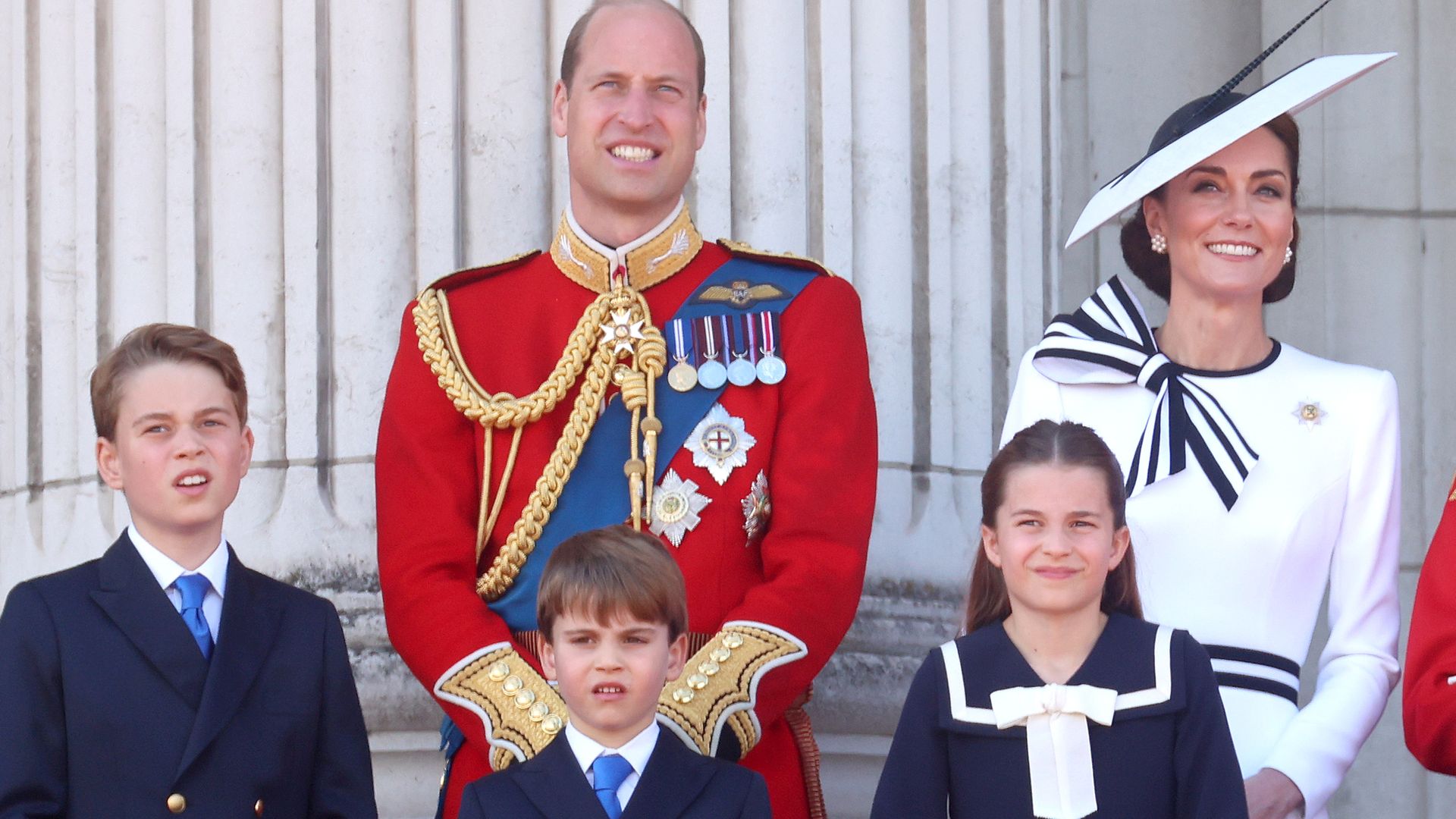 LONDON, ENGLAND - JUNE 15: (L-R) Prince George of Wales, Prince William, Prince of Wales, Prince Louis of Wales, Catherine, Princess of Wales, Princess Charlotte of Wales and King Charles III on the balcony during Trooping the Colour at Buckingham Palace on June 15, 2024 in London, England. Trooping the Colour is a ceremonial parade celebrating the official birthday of the British Monarch. The event features over 1,400 soldiers and officers, accompanied by 200 horses. More than 400 musicians from ten different bands and Corps of Drums march and perform in perfect harmony. (Photo by Chris Jackson/Getty Images)
