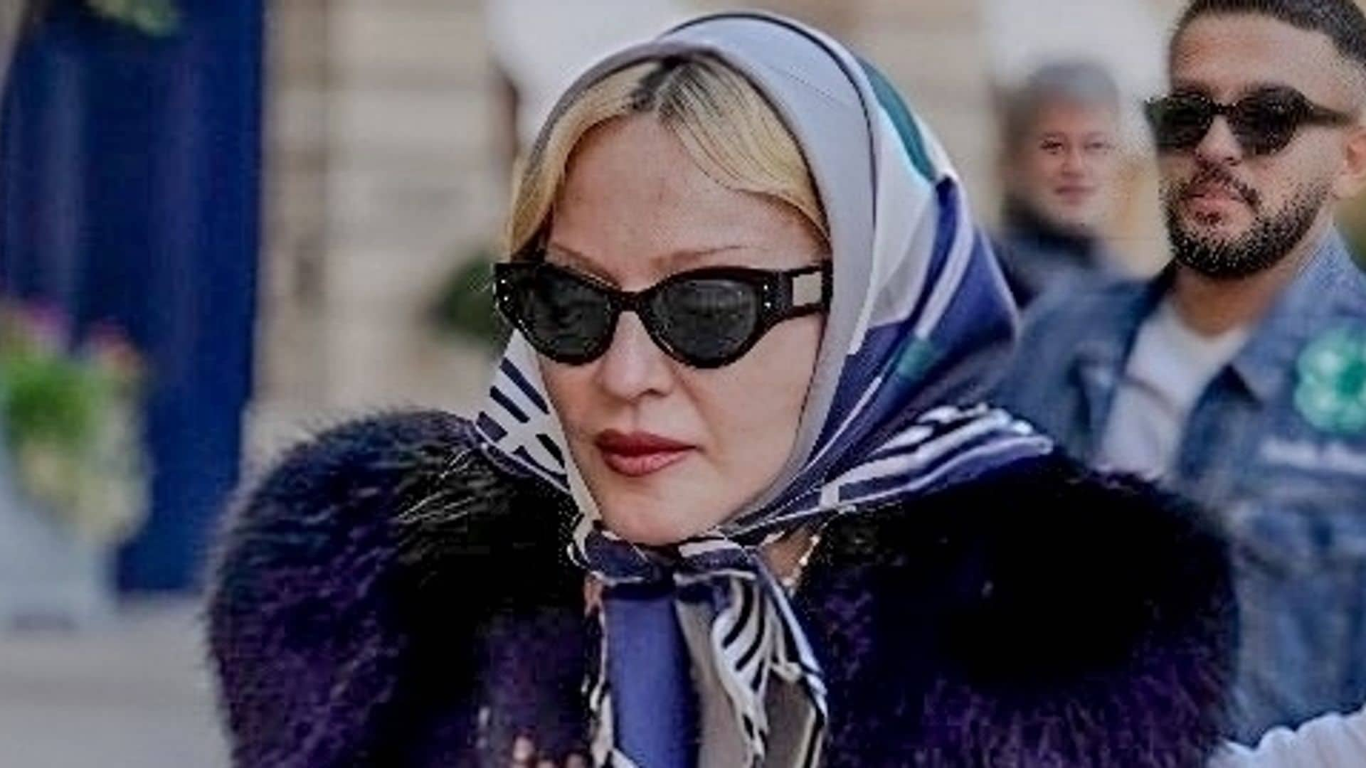 Madonna stuns in Paris with a chic all-black look and trendy headscarf