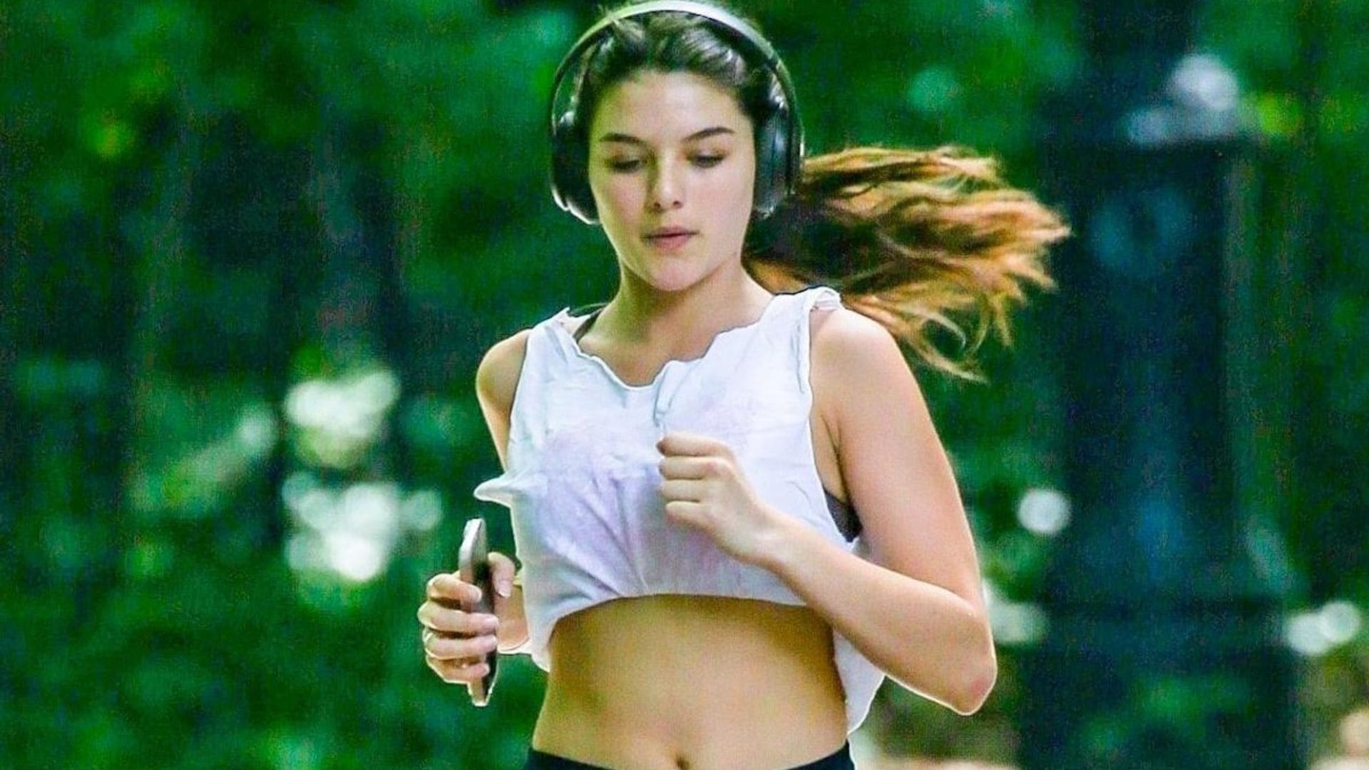 Suri Cruise wears white crop top and black shorts while working out in New York City