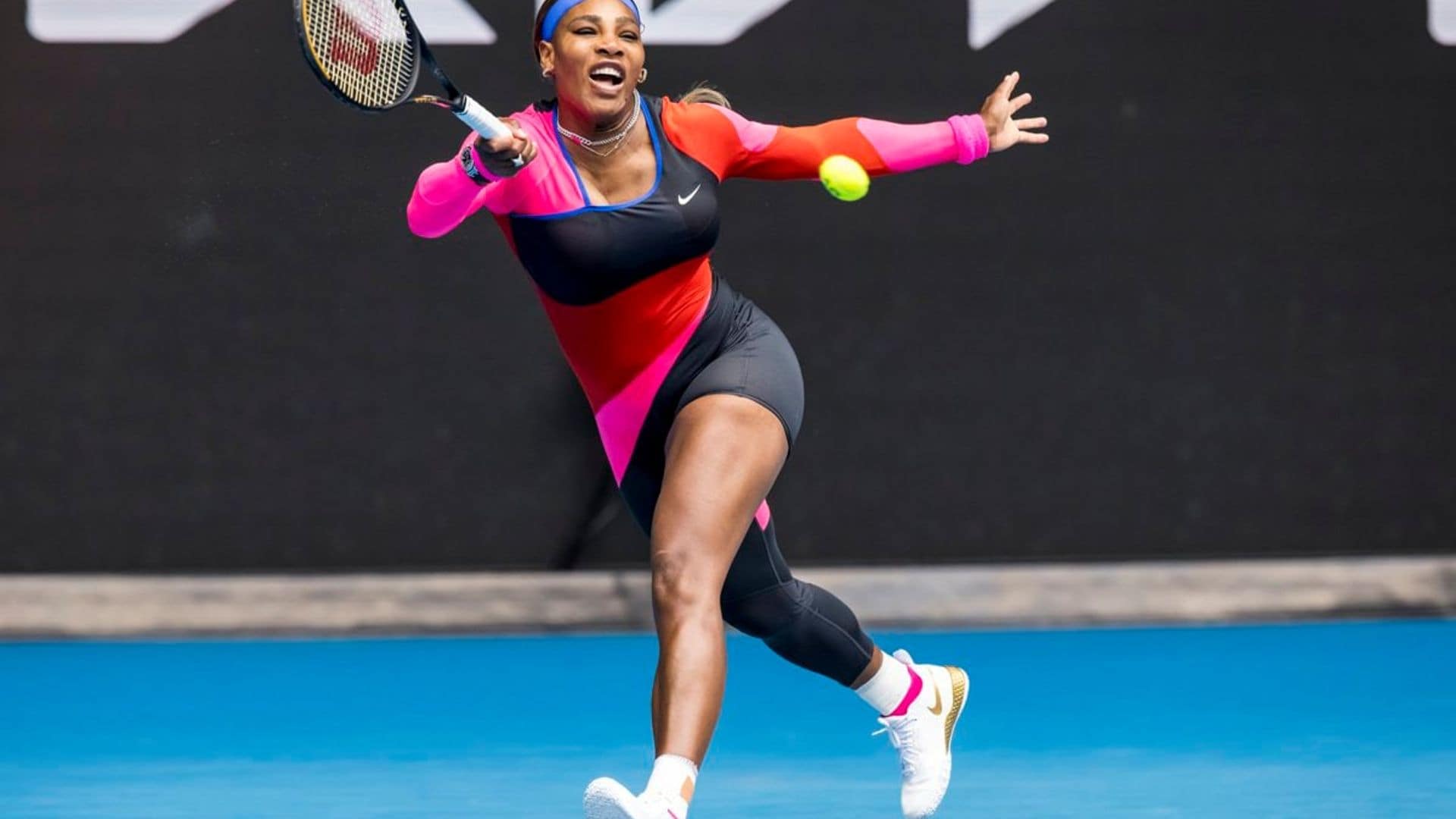 Serena Williams turned heads in a colorful catsuit that was half pants half shorts