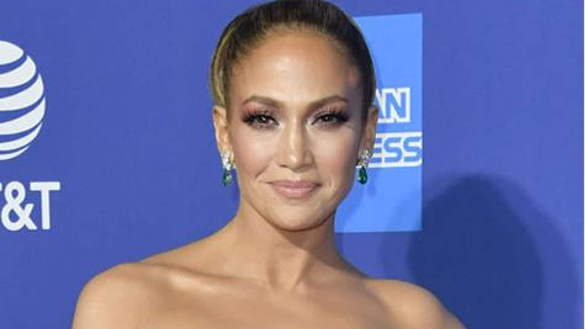 Jennifer Lopez poses with her award at Palm Springs Film Festival