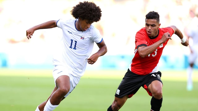 Peter Gonzalez, #11 of Team Dominican Republic, runs with the ball under pressure from Karim el Debes, #13 of Team Egypt, during the Men's group C match between Egypt and the Dominican Republic during the Olympic Games Paris 2024 at Stade de la Beaujoire on July 24, 2024, in Nantes, France. 