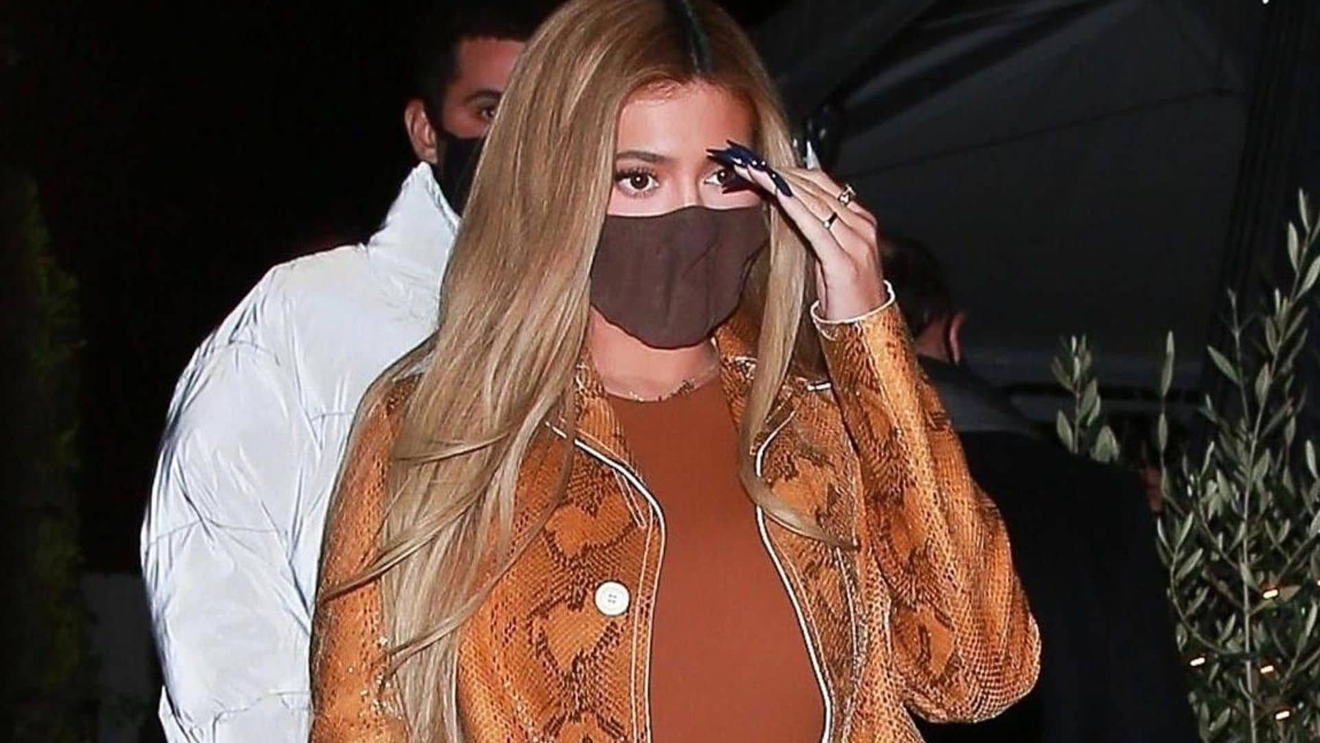 Kylie Jenner went to dinner in a stunning $3,000 snakeskin print coat