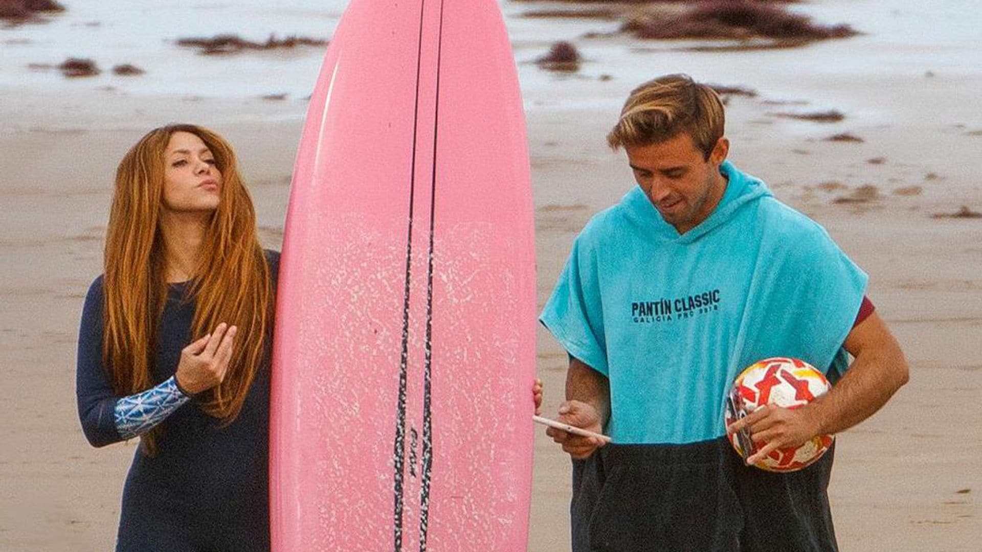 Shakira photographed with her kids and a hot surf instructor