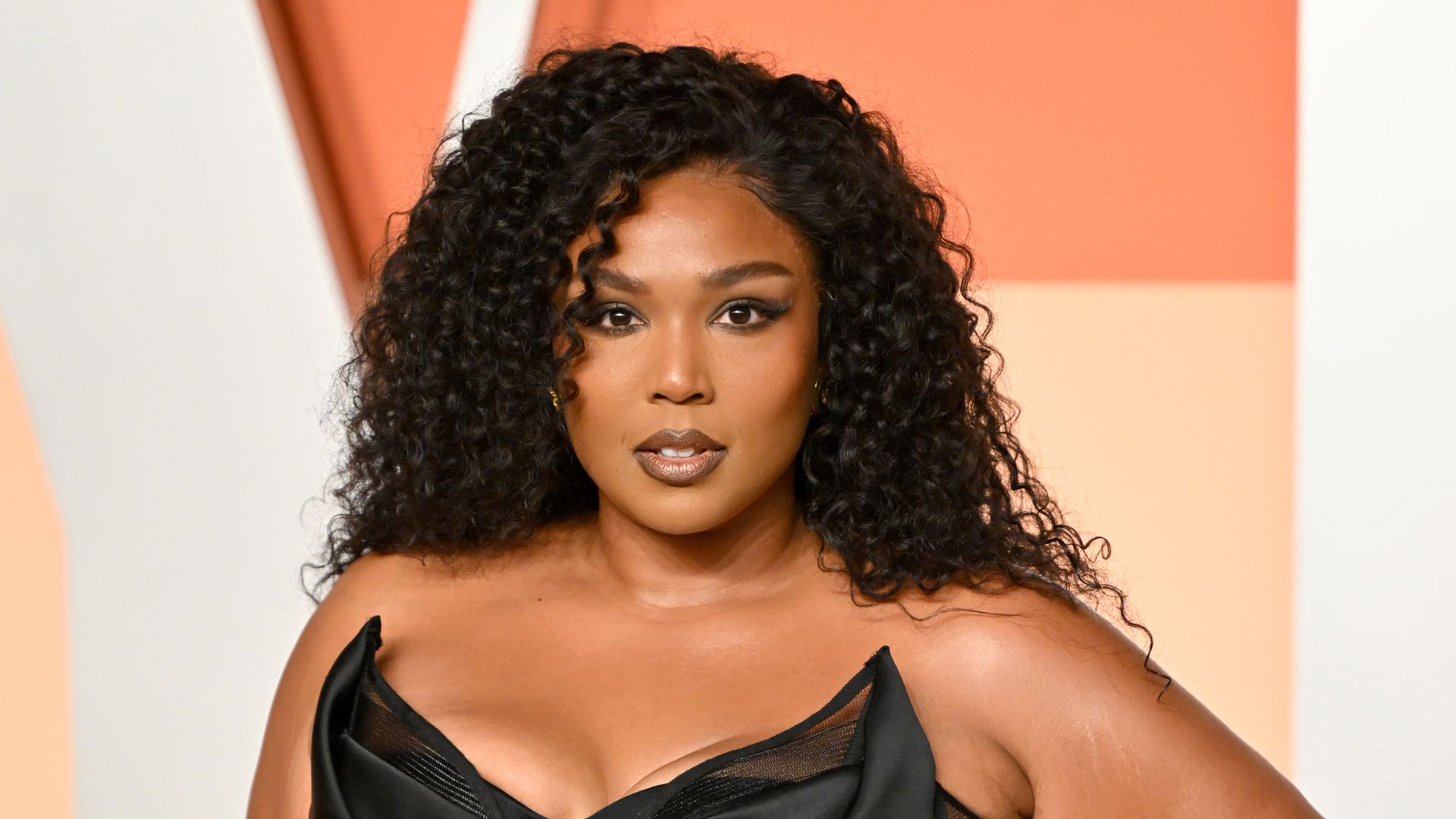 Lizzo shows off her figure in stunning gown months after announcing she hit her 'weight release goal'