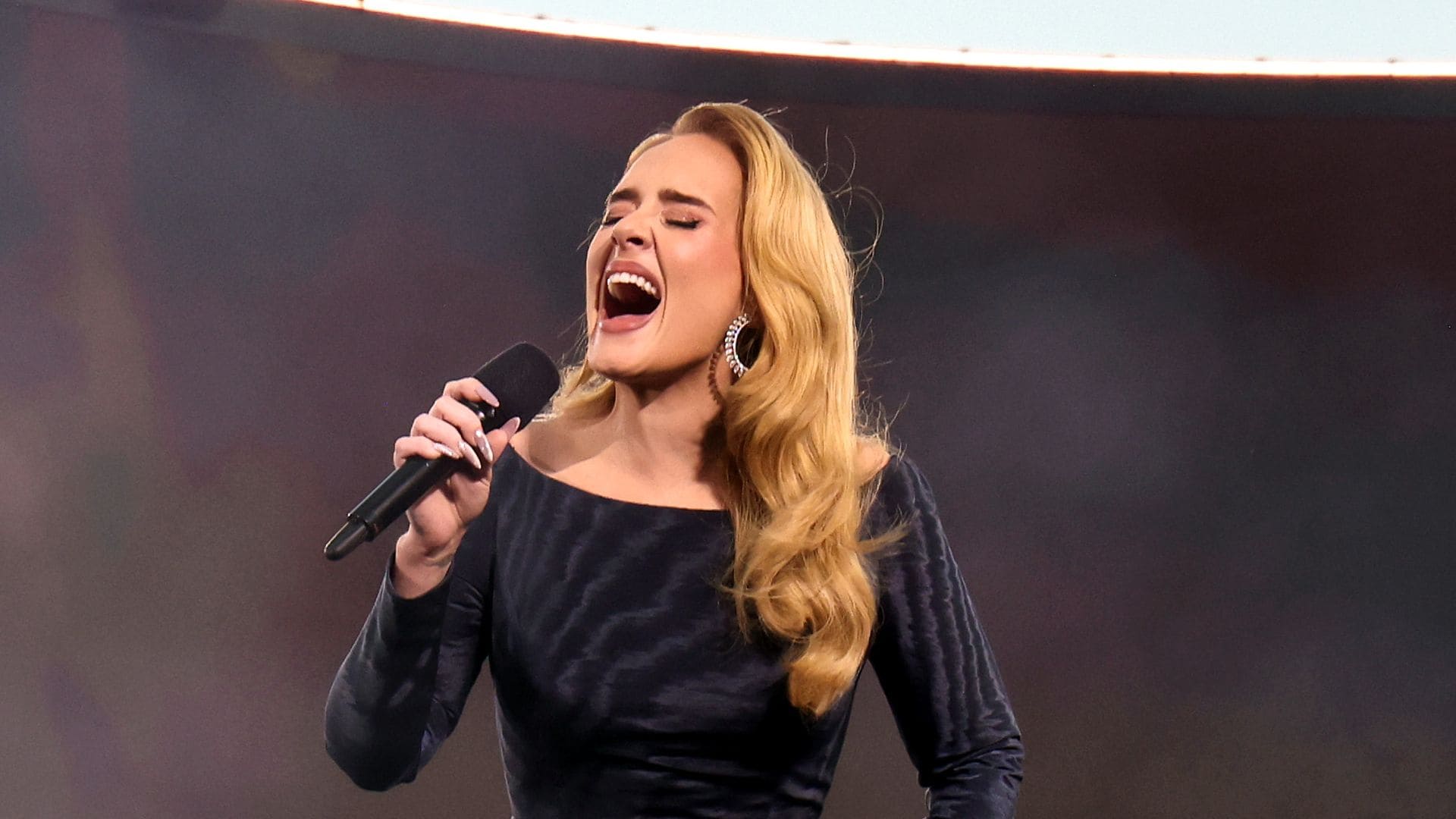 Adele, in tears, shares she is taking a long break from performing