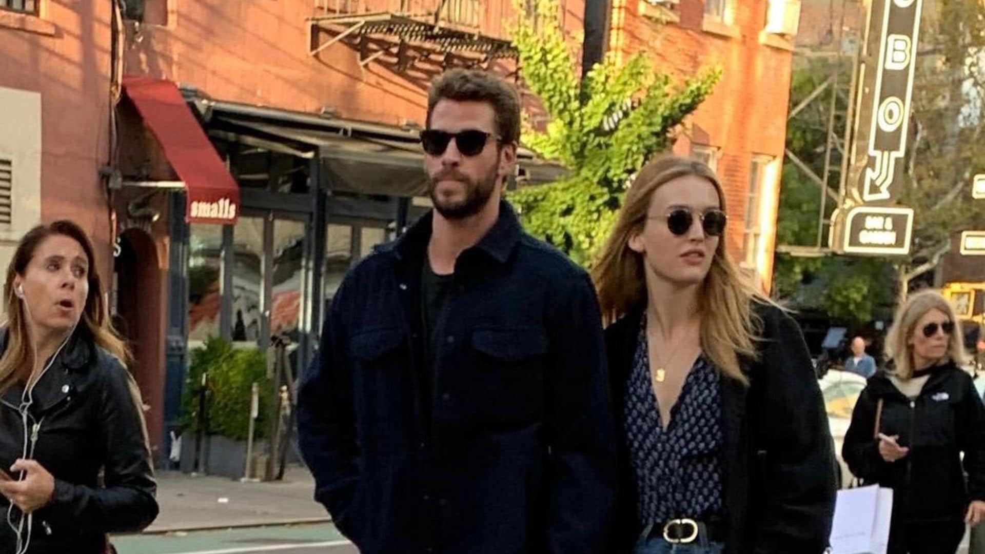 Liam Hemsworth's cuddles up to new girlfriend Maddison Brown - see the pics!