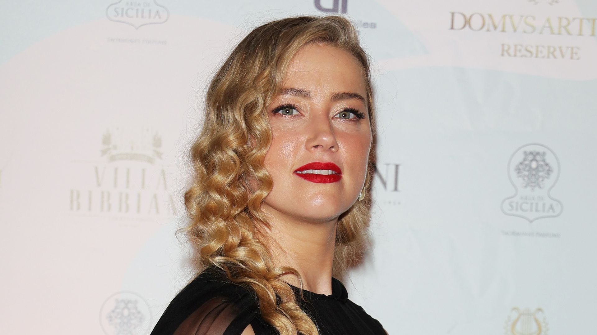 Amber Heard embraces the Holidays in Spain with her mini-me