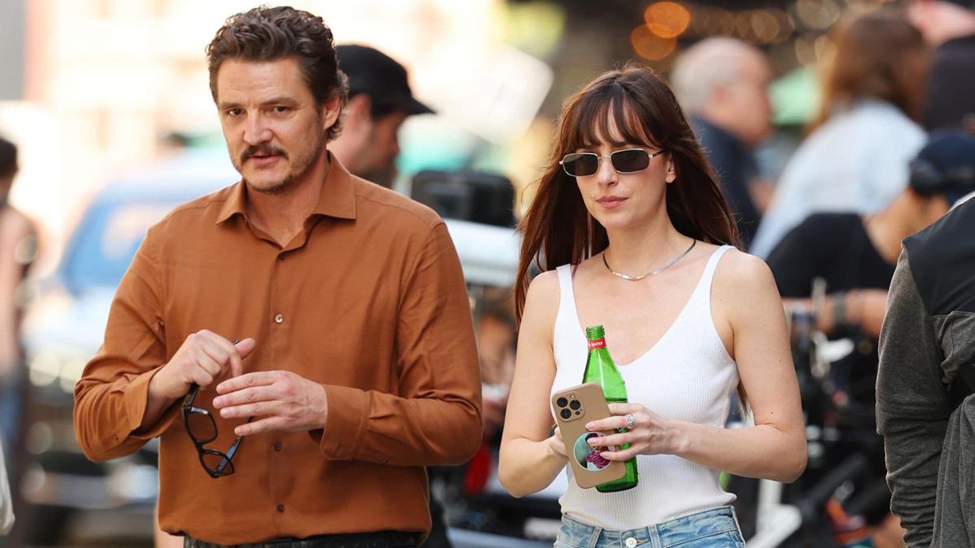 Dakota Johnson and Pedro Pascal pack on PDA while filming a new rom-com