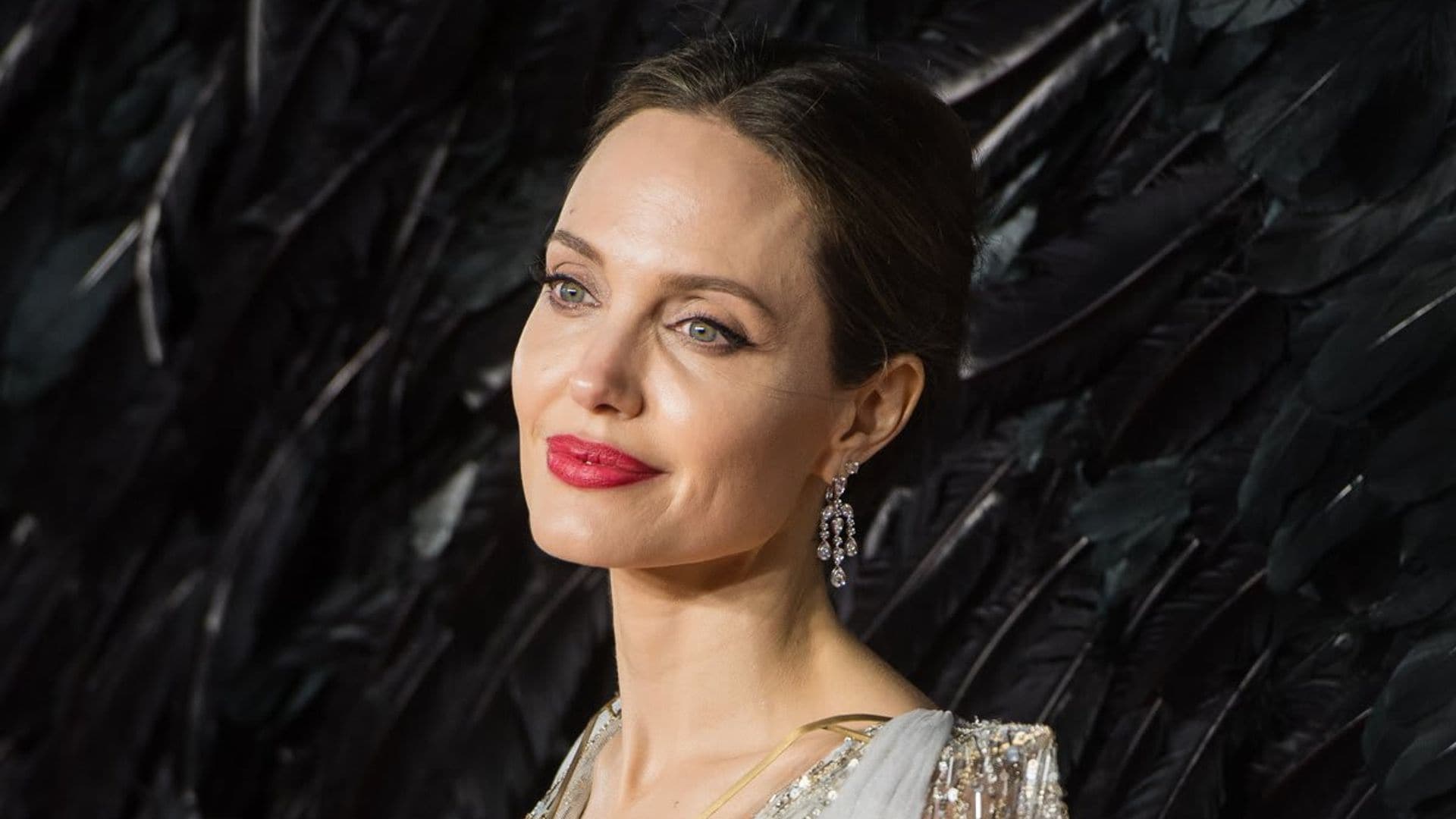 Angelina Jolie hangs out with ex-husband Jonny Lee Miller at his apartment for the second time in a week