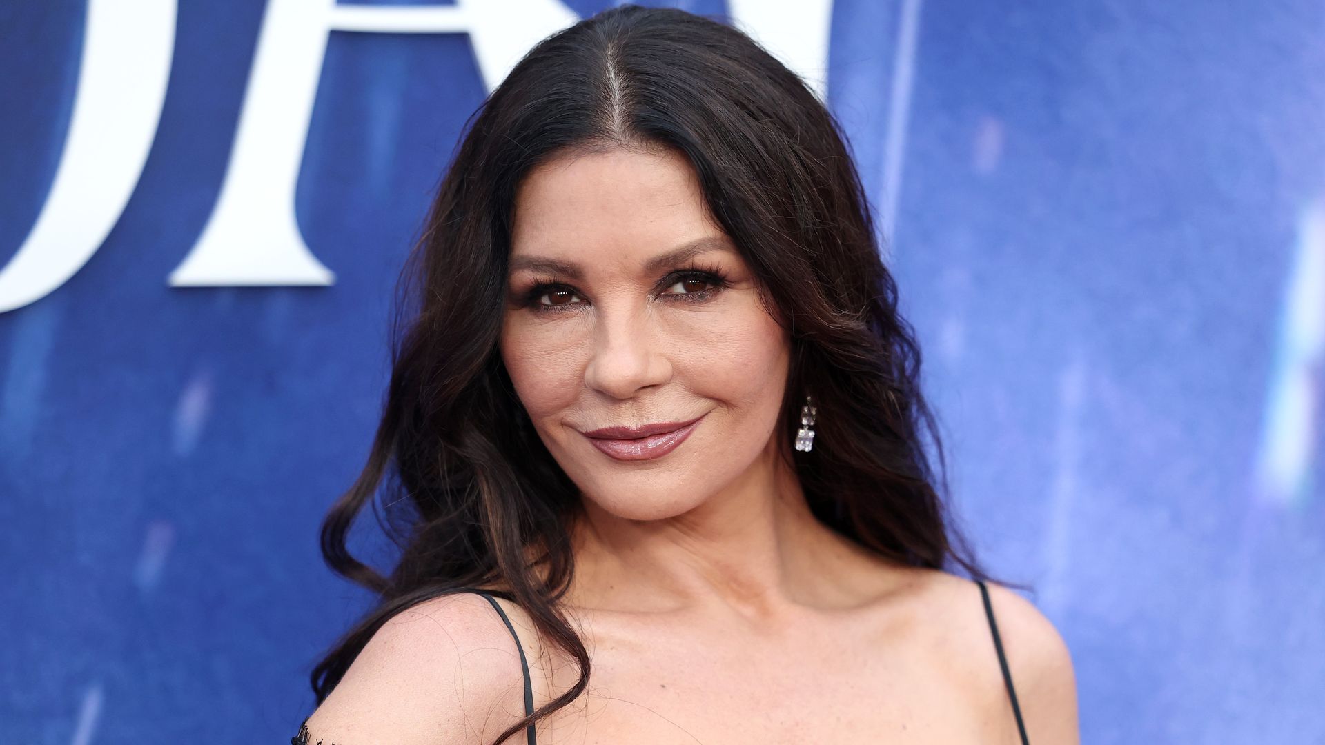 Catherine Zeta-Jones is welcomed home by her dog after months away shooting 'Wednesday'