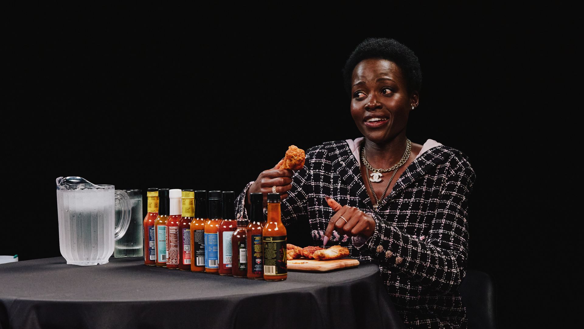 Lupita Nyong'o eats hot wings while discussing her fear of cats and scary movies