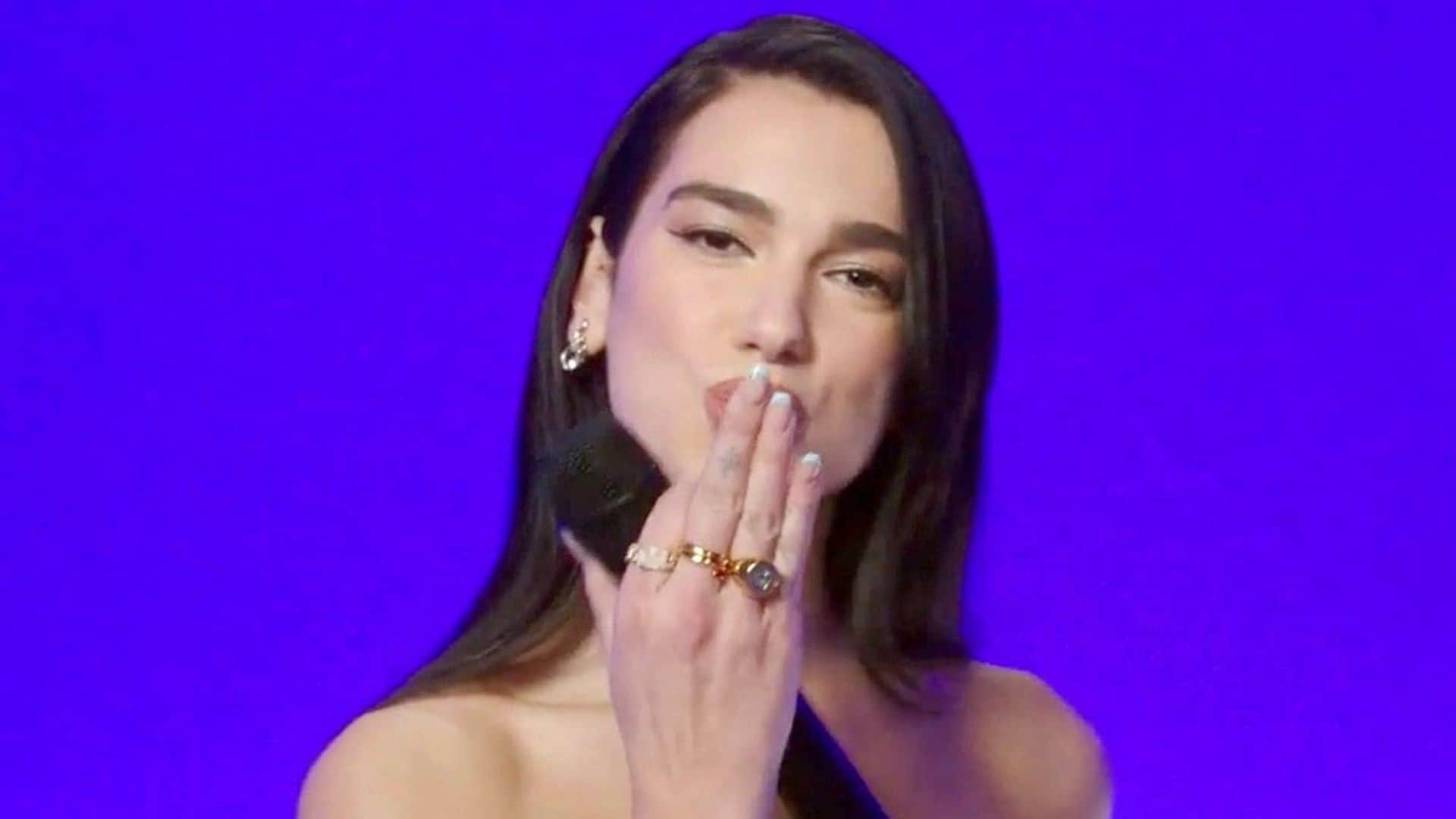 Dua Lipa shows sun-kissed skin in a cut-out mini dress