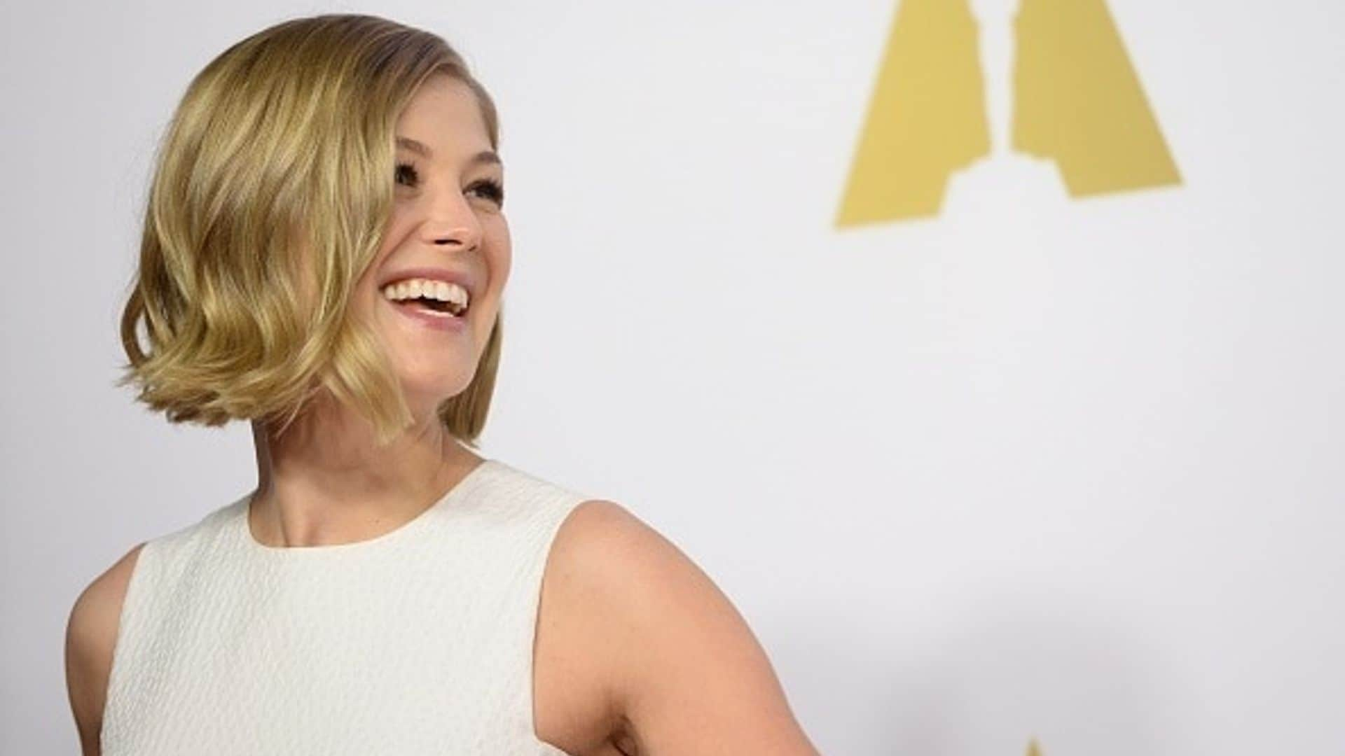 Rosamund Pike is a vision in white at Oscars Nominee Luncheon