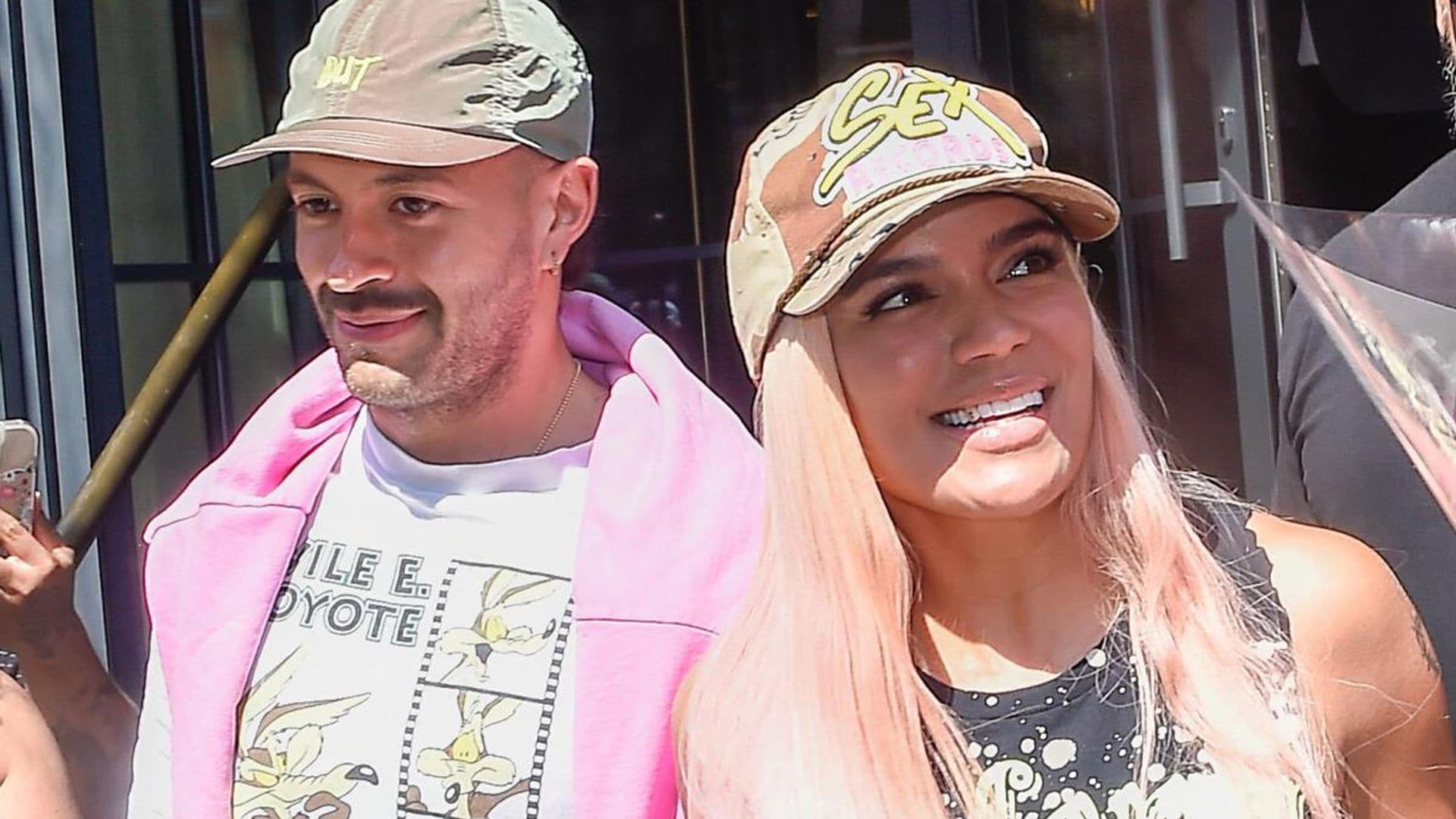 Karol G and Feid are all smiles holding hands in NYC during romantic outing