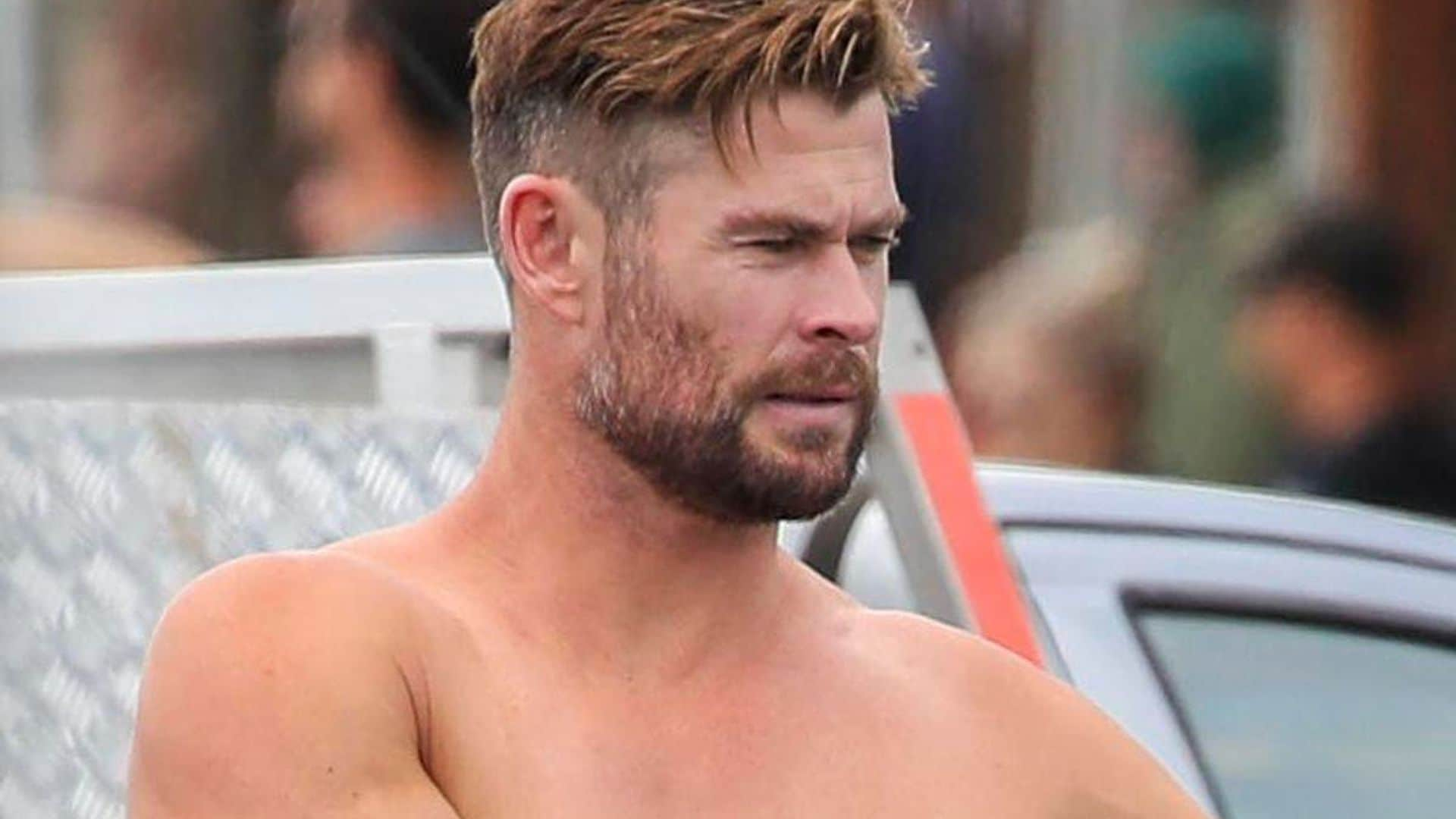 Chris Hemsworth shows off his incredible physique while surfing in Byron Bay