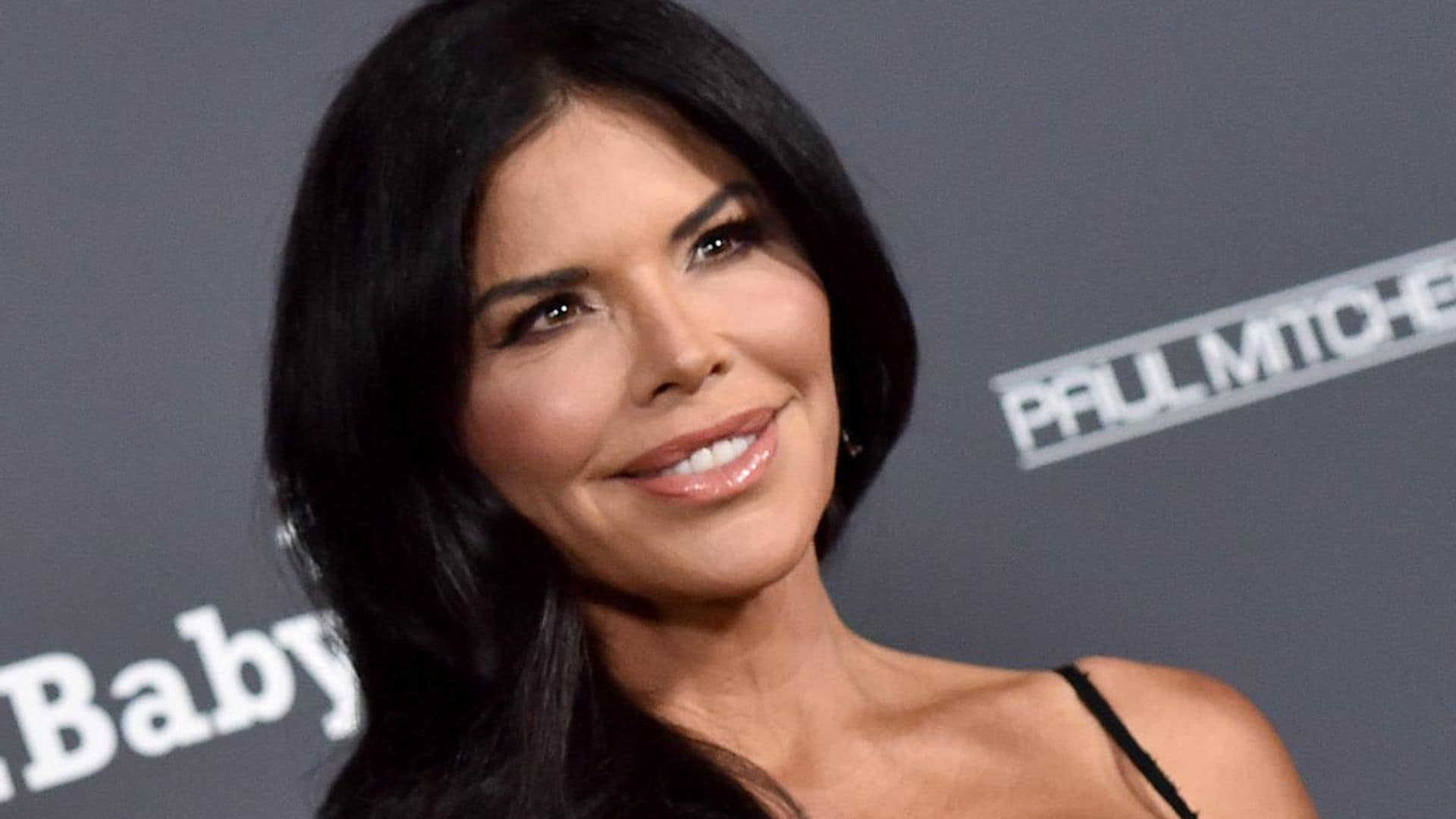 Lauren Sanchez shows off her press-on nails while flying a helicopter