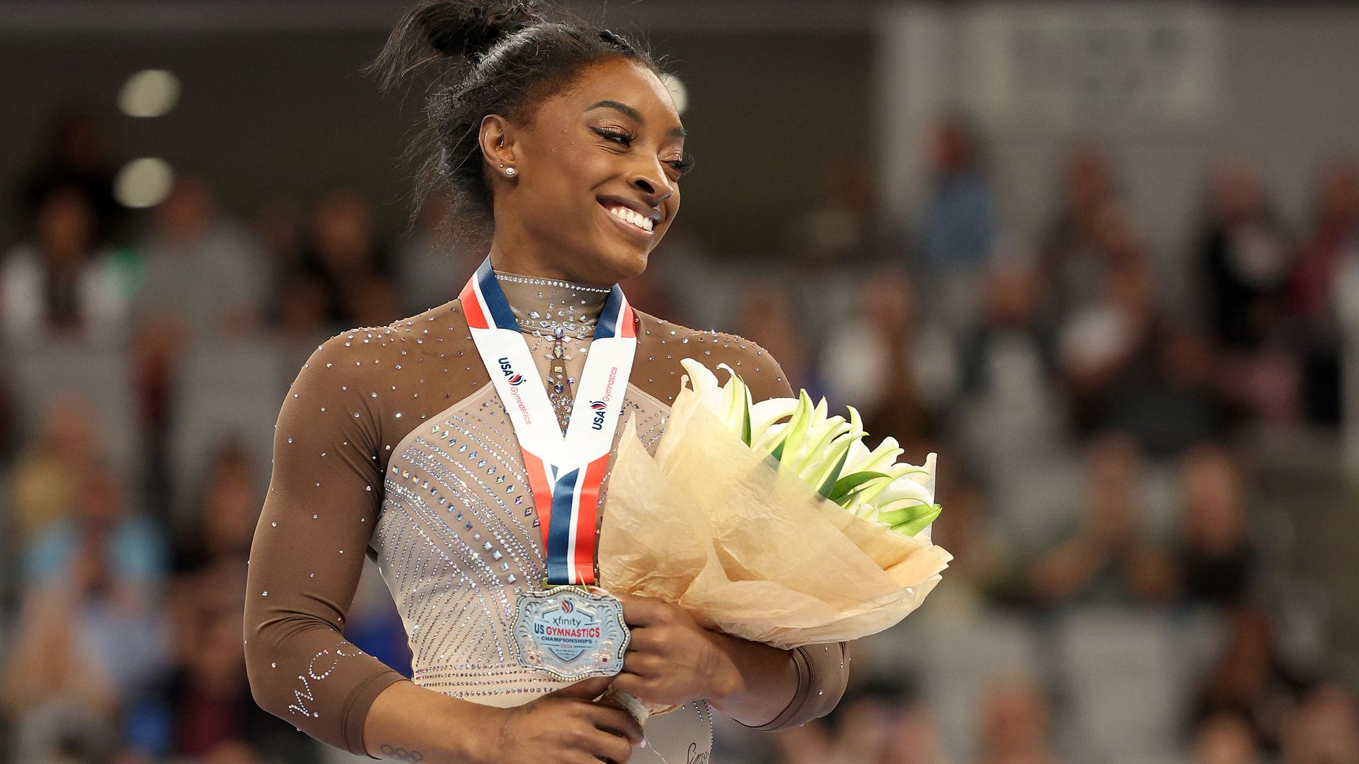 First-place all-around winner Simone Biles celebrates after the 2024 Xfinity U.S. Gymnastics Championships at Dickies Arena on June 02, 2024, in Fort Worth, Texas. 