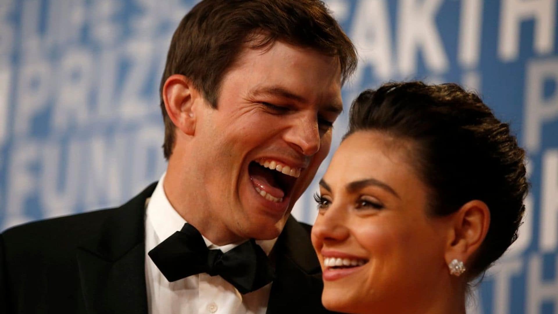 Actor Ashton Kutcher laughs with his wife actress Mila Kunis while posing for pictures on the red carpet for the 6th annual 2018 Breakthrough Prizes at Moffett Federal Airfield, Hangar One in Mountain View, Calif., on Sunday, Dec. 3, 2017. (Nhat V. Meyer/