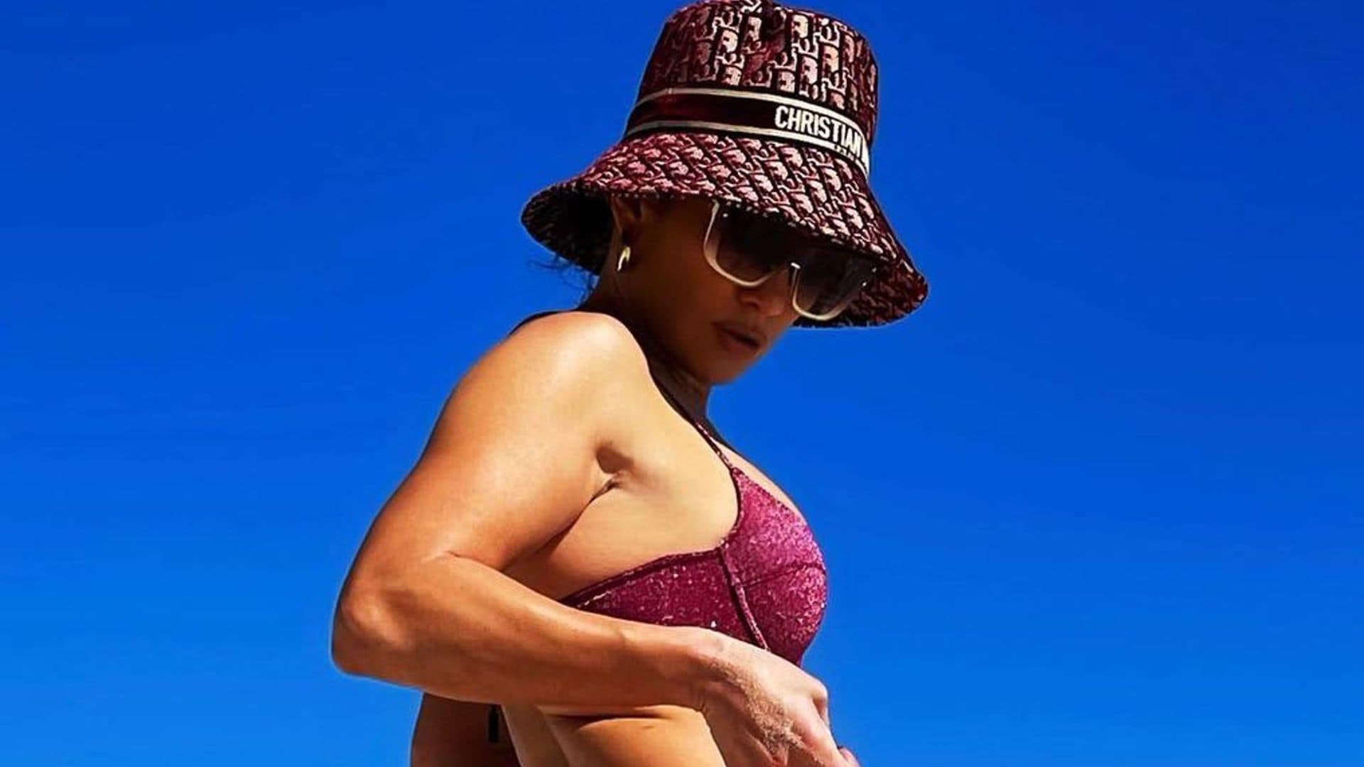 Jennifer Lopez’s ‘beach bum’ is sparkling in a purple bikini