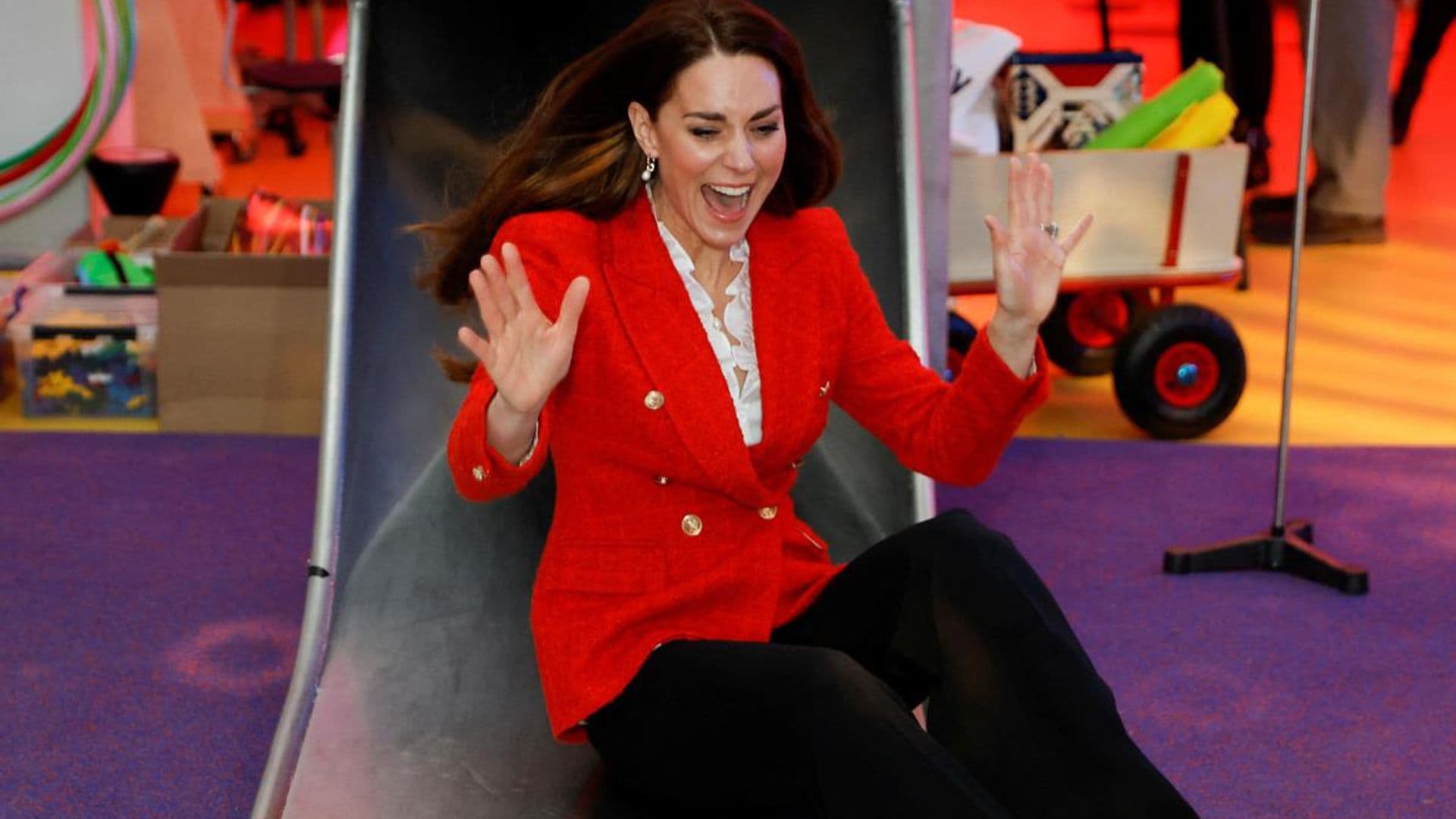 Kate Middleton goes down a slide in pumps: Watch the fun video