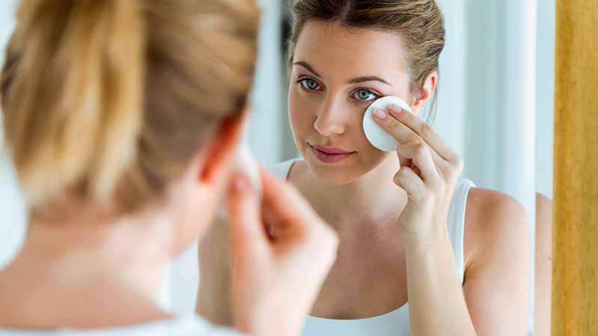 Woman cleaning her skin