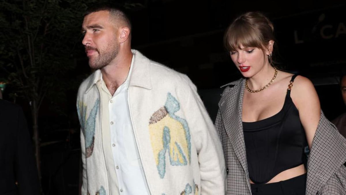 Taylor Swift and Travis Kelce celebrate win with champagne