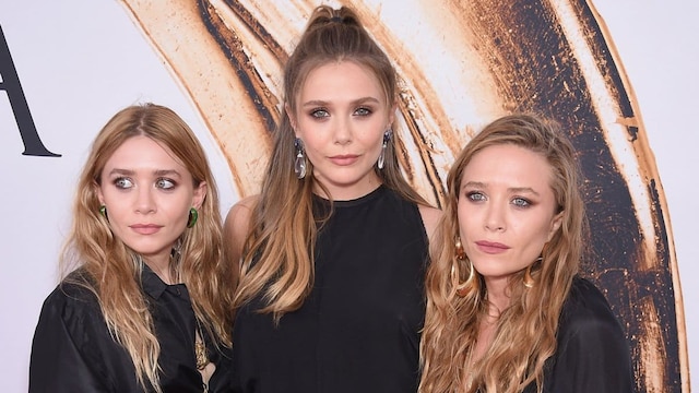 Elizabeth Olsen (center) and Mary-Kate and Ashley Olsen attend the 2016 CFDA Fashion Awards