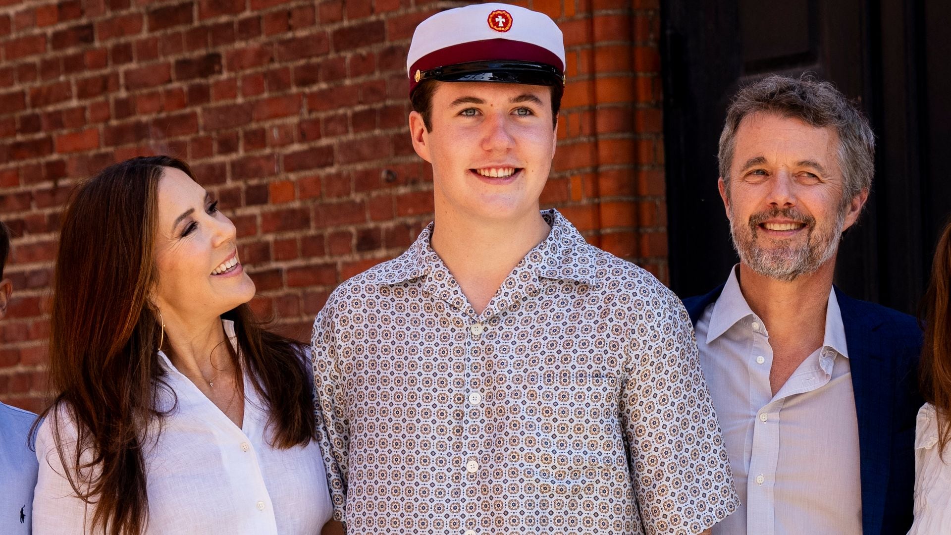Denmark's Crown Prince Christian (C) poses with his parents King Frederik X of Denmark (3rd R) and Queen Mary of Denmark (2nd L) and his siblings, Prince Vincent (L), Princess Josephine (R) and Princess Isabella (2nd R), after completing his final exam and becoming a graduate from Ordrup Gymnasium, High School, in Copenhagen, Denmark, on June 24, 2024. (Photo by Ida Marie Odgaard / Ritzau Scanpix / AFP) / Denmark OUT (Photo by IDA MARIE ODGAARD/Ritzau Scanpix/AFP via Getty Images)