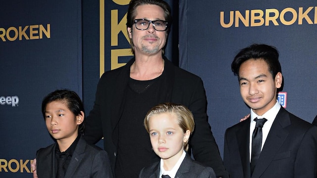 Brad Pitt posing with children Shiloh, Pax and Maddox