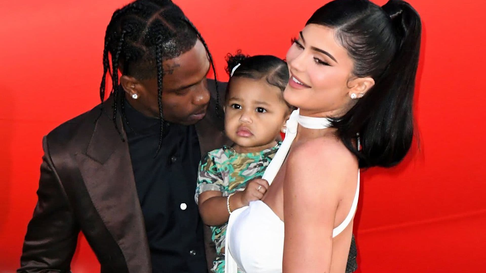 Stormi Webster has a water balloon fight with parents Kylie Jenner and Travis Scott