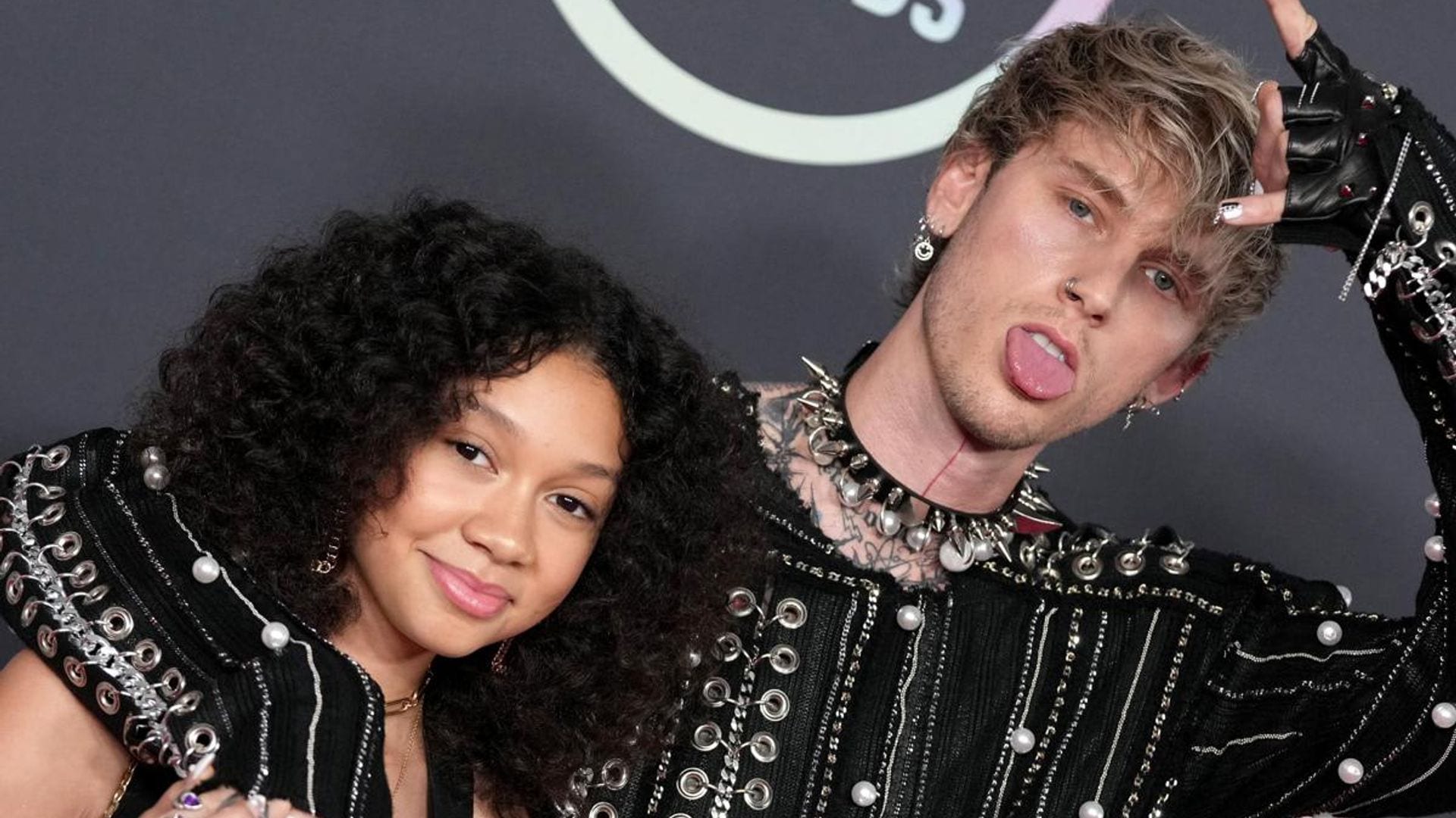 Machine Gun Kelly shows off his parenting skills after cutting himself with a glass