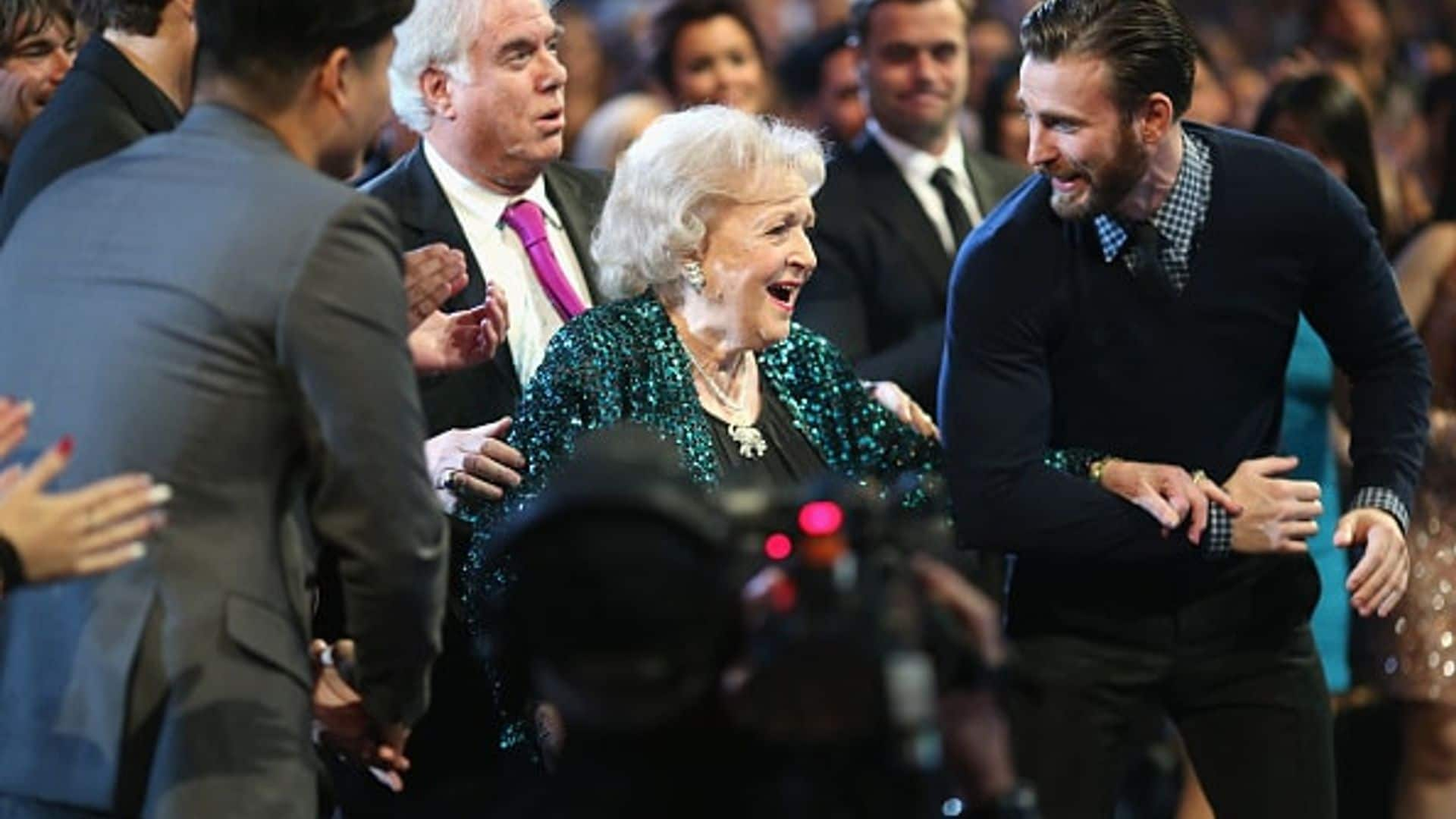 Chris Evans serves as Betty White's arm candy at People's Choice Awards