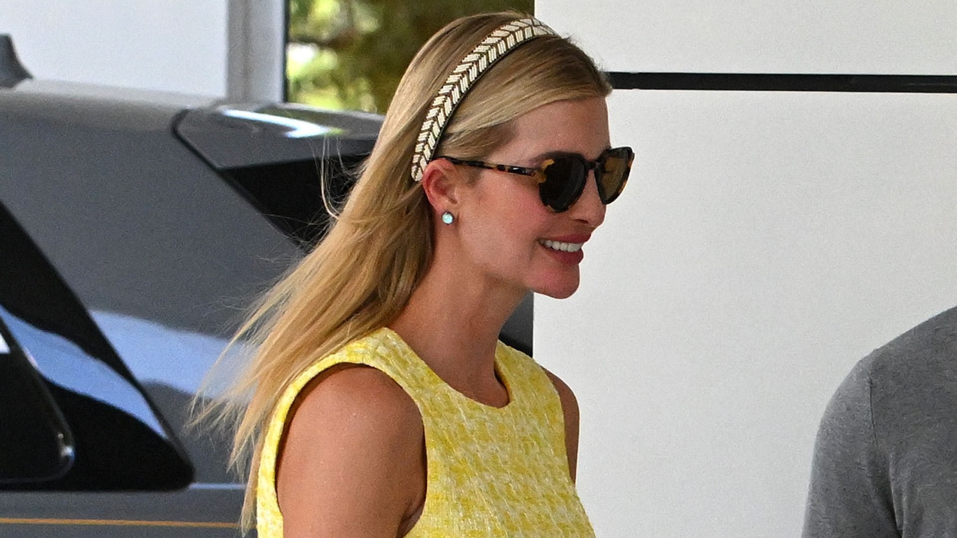 Ivanka Trump was all smiles posing in floral dress and diamond earrings