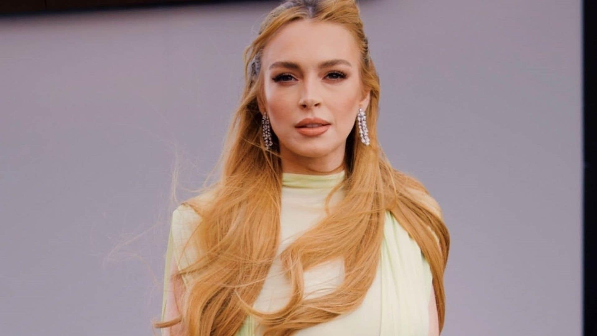 Lindsay Lohan shows off glamorous look including metallic heels and diamond earrings