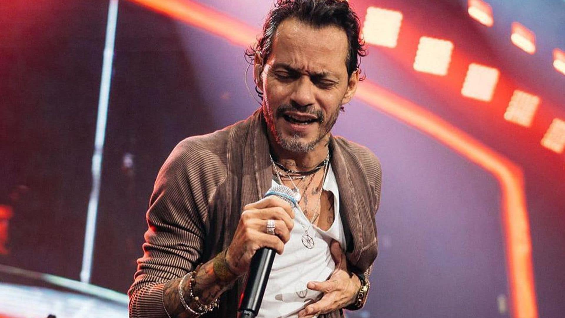 Marc Anthony almost gets crushed during epic backstage hug with his number one celebrity fan