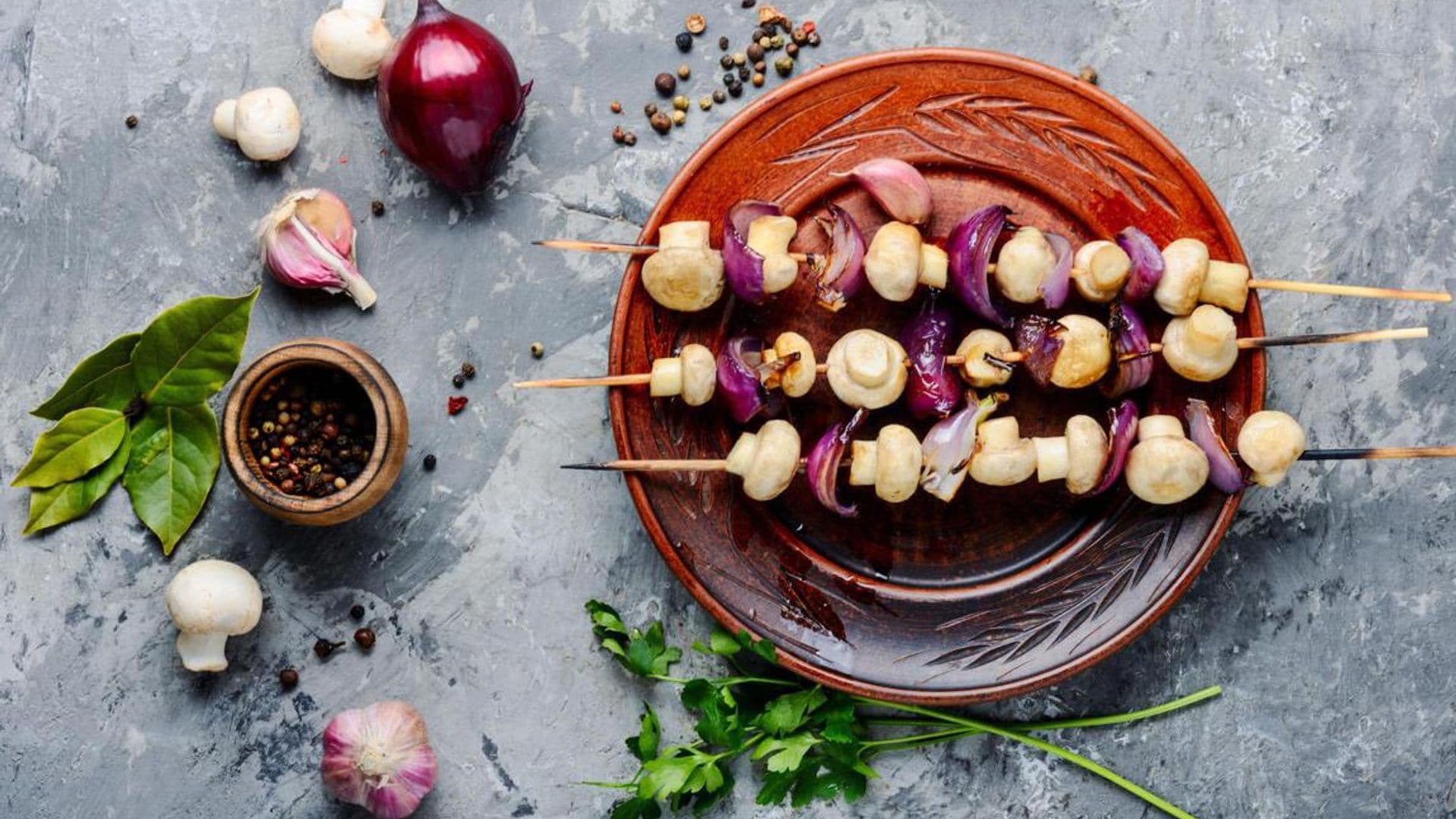 Grilled mushrooms on wooden skewers. Vegetable shish kebab